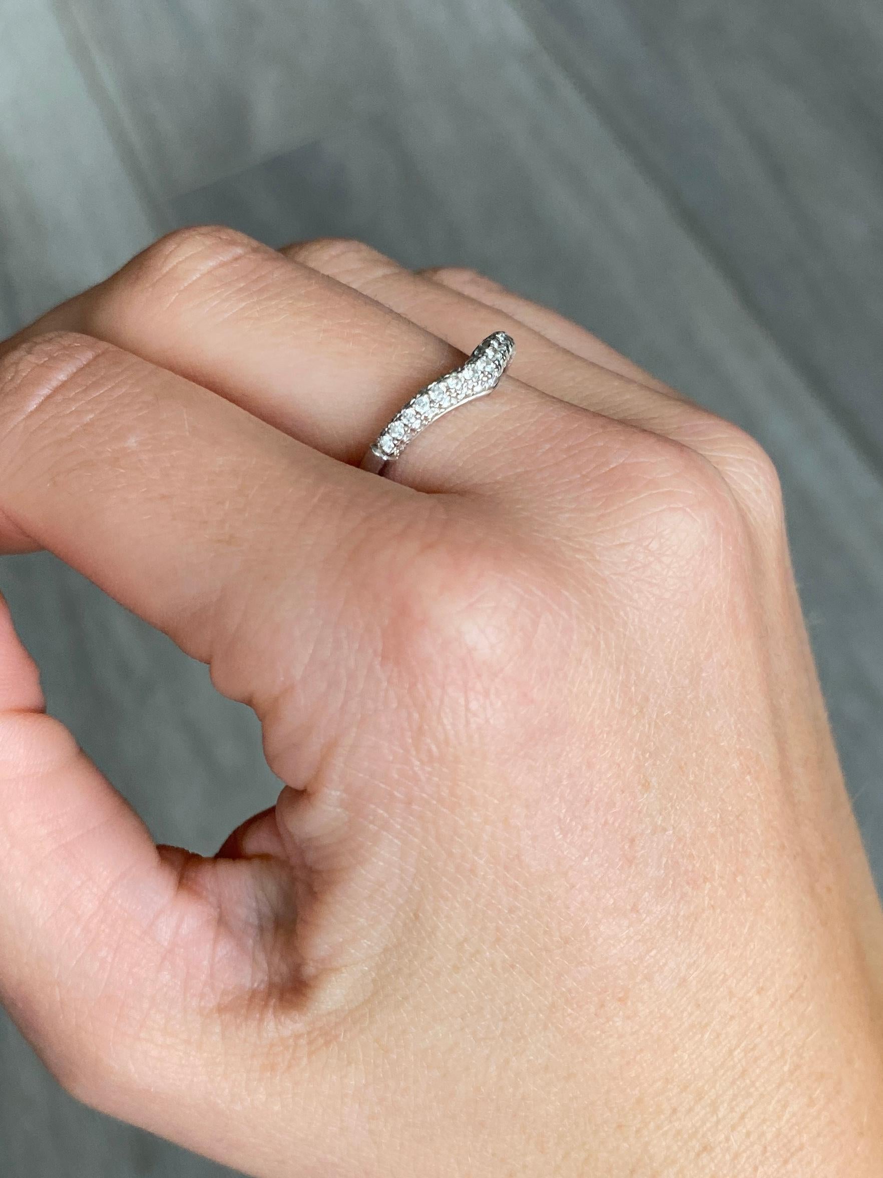 This stylish wave ring is modelled in 18carat white gold and is encrusted with sparking diamonds totalling 45pts.

Ring Size: N or 6 3/4 
Band Width: 3.5mm

Weight: 2.7g