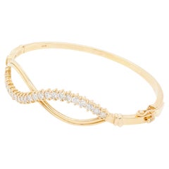 Diamond and 18 Carat Yellow Gold Infinity Bangle Bracelet, 1981