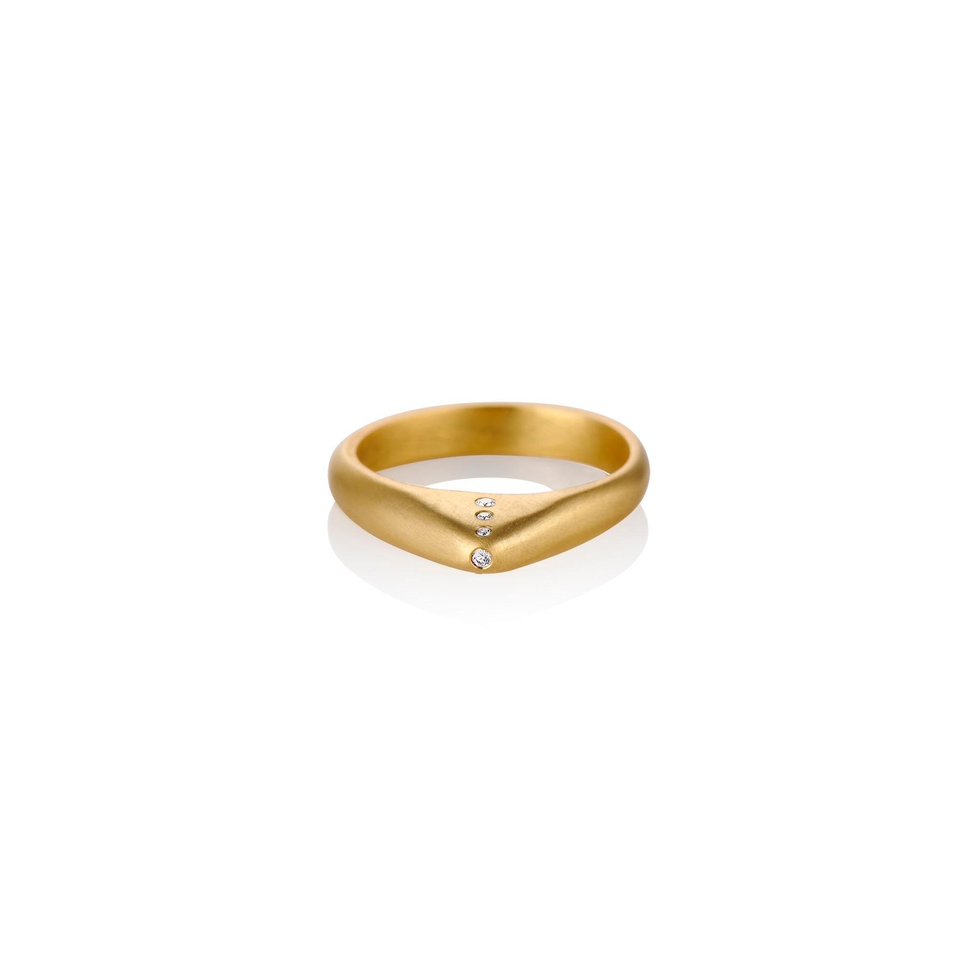 This contemporary 18 karat yellow gold ring with seven white round diamonds was inspired by the Medieval Stirrup Rings in England.  This stirrup ring has a warm matte finish which juxtaposes beautifully against the bright white diamonds.  Size 6