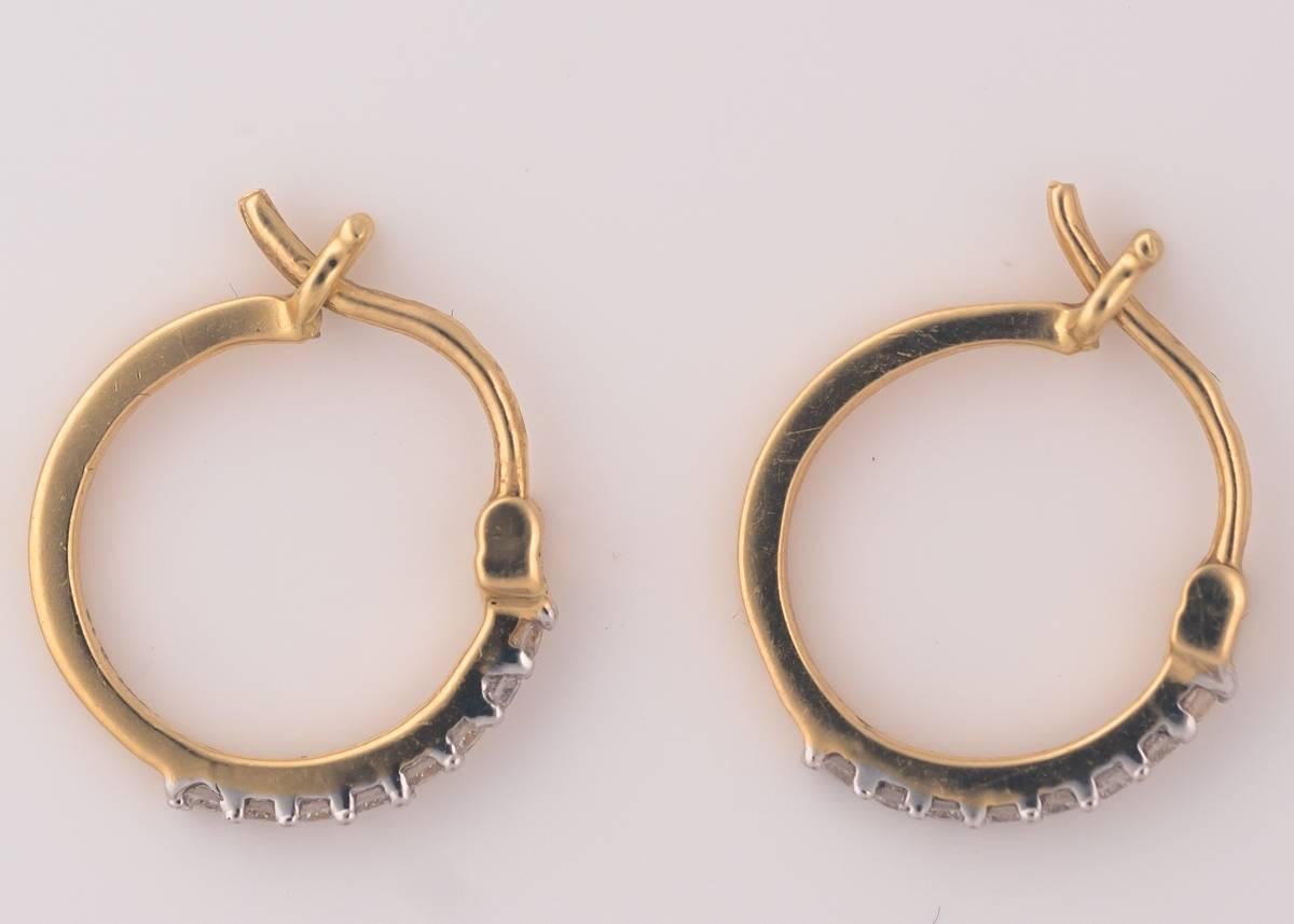 2017 Mini Hoop Earrings - 18 Karat Yellow Gold, Diamonds
Made in House!

These Dainty Diamond Hoops feature .13 carats of Round Brilliant Diamonds prong set in rich 18 Karat Yellow Gold. The Diamonds Sparkle and Shine. They have hinged snap back