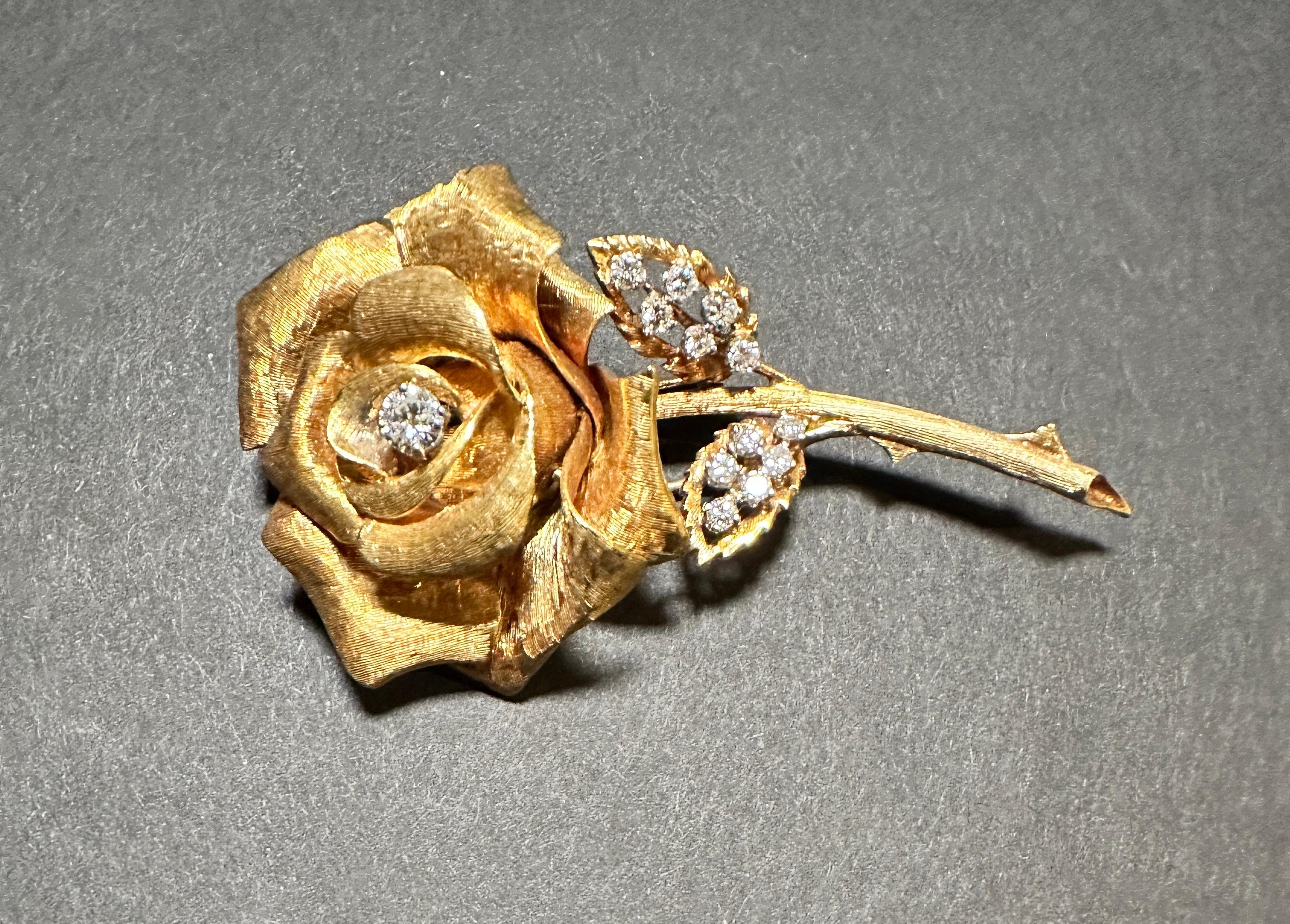 18k yellow gold and diamond rose form pin  brooch by Erwin Pearl. 13 brilliant cut round prong set diamonds. 
Approx. total diamond weight .9cts 
Also features a double hinged stick pin backing.
30.2 grams 66 x 36.5 mm 
Born in Austria, Erwin Pearl