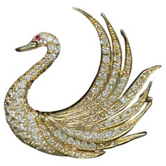Spilla a forma di cigno in oro 18 carati e diamanti