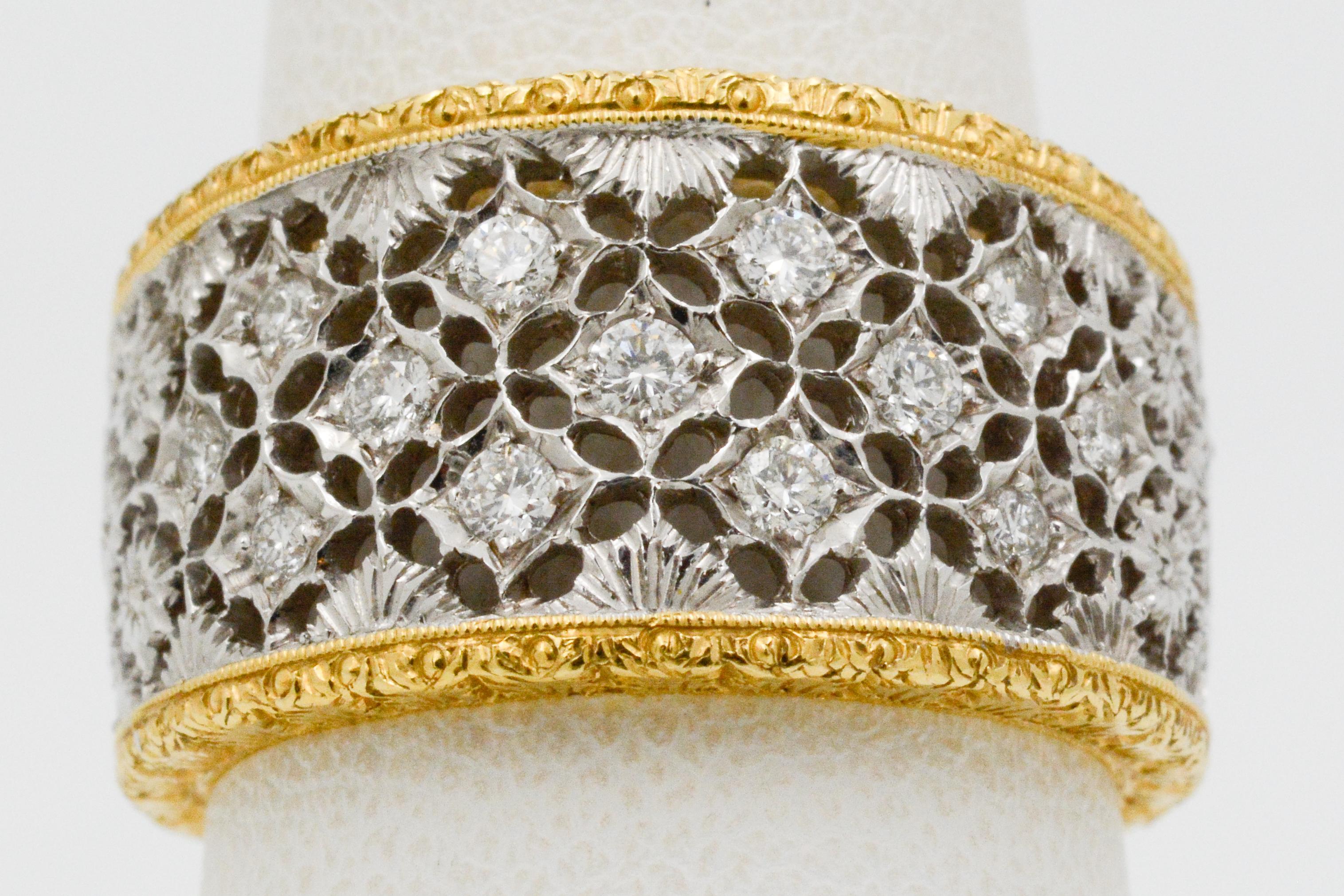 This ring has a unique filigree design showcasing 13 round brilliant diamonds, weighing approximately 0.34 carats. The diamonds are surrounded by 18 karat white and yellow gold etched flowers and engraved edges. The ring measures at 12 x 18mm and
