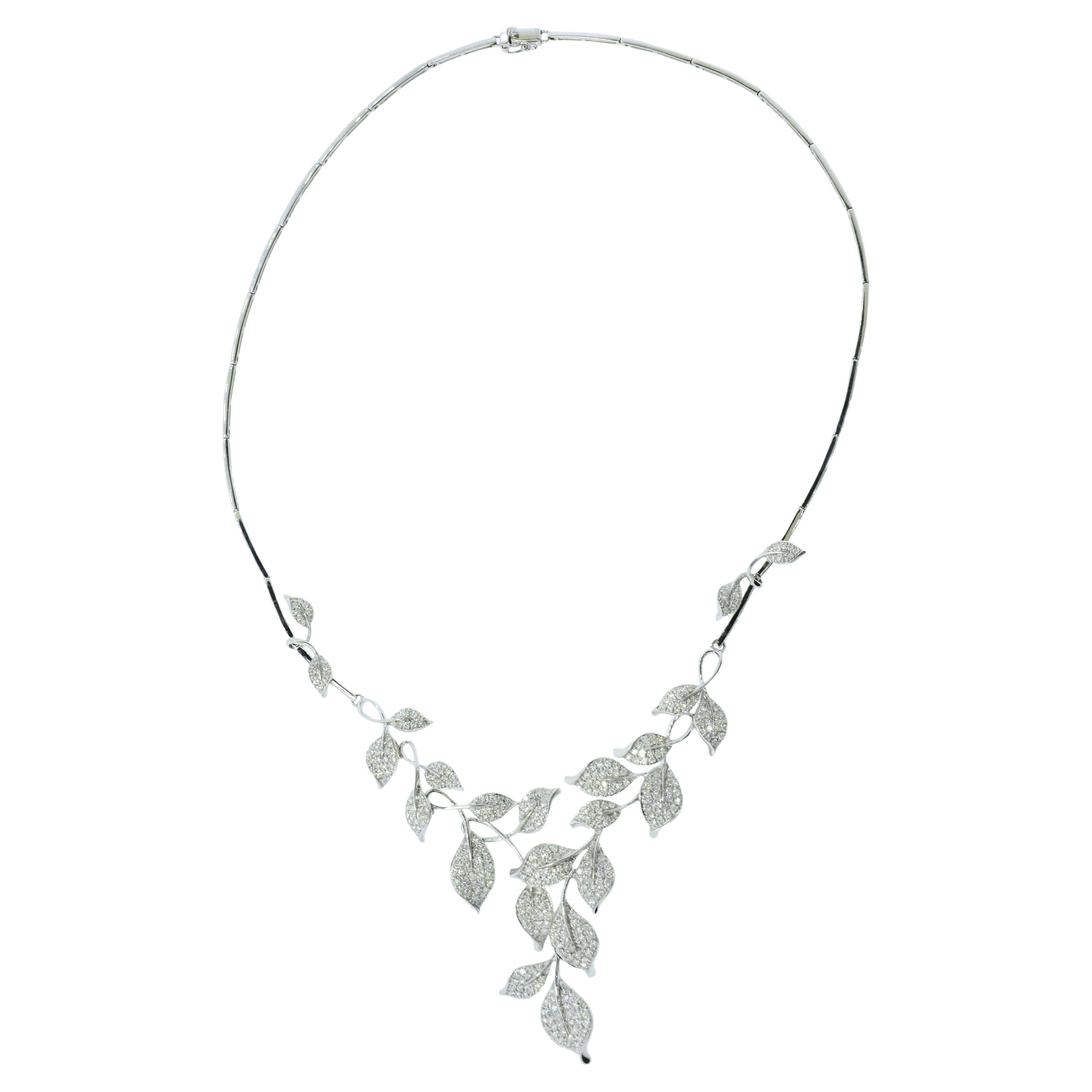 Fine diamond contemporary well made necklace composed of stylized foliage in 18K white gold.  With a length of 16.75 inches long, this diamond pave necklace in 18K white gold has 23 leafs at its center which contain 405 diamonds amounting to an