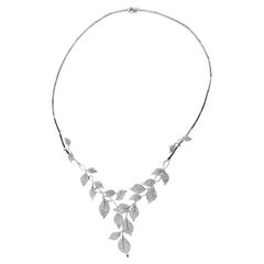 Diamond and 18K White Gold Contemporary Necklace of Stylized Foliage.