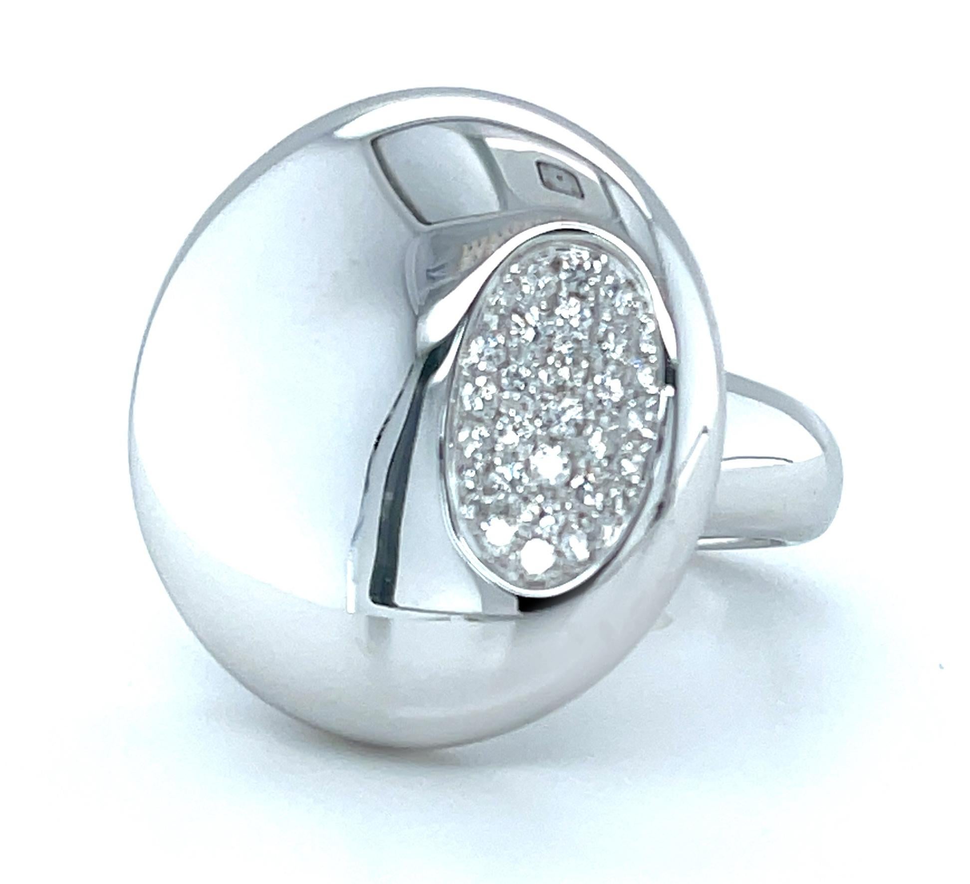 Show off your bold sense of style with this chic, diamond-studded 18k white gold ring! The beautifully high-polished dome looks fabulous worn on any finger and the sea of diamonds embedded in the oval concave give the ring a cool look that can't be