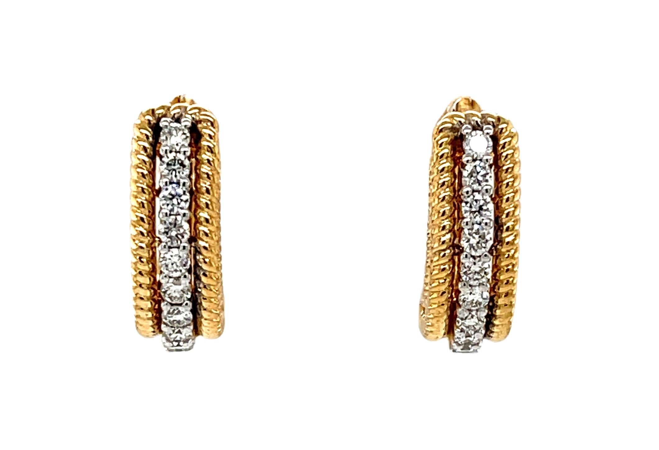 These beautiful two-toned gold and diamond hoop earrings are perfect for everyday and special occasion wear! A sparkling line of brilliant diamonds set in 18k white gold is 
 bordered by a detailed rope design made of 18k yellow gold. These