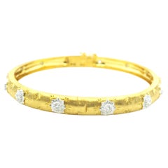 Bracelet jonc en or jaune et blanc 18 carats, finition satinée