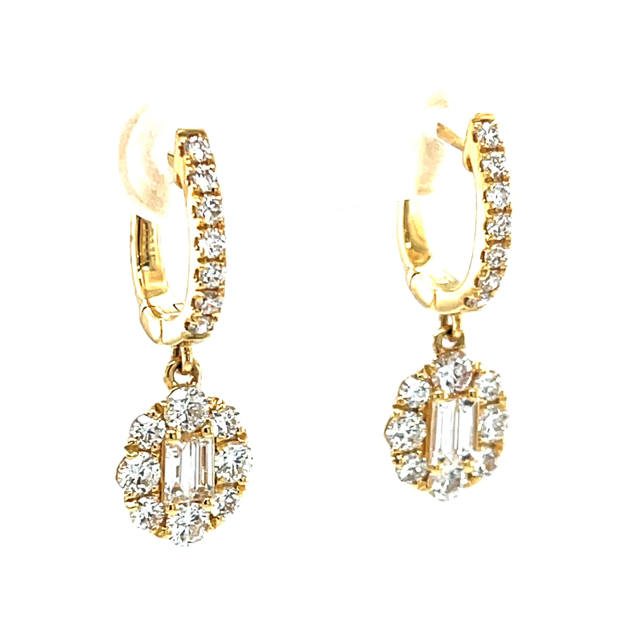 These pretty earrings add something extra special to your day! Crafted in 18k yellow gold, the hinged hoops sparkle with elegant lines of brilliant  diamonds that lead to stunning floral dangle drops. The drops have baguette diamond centers
