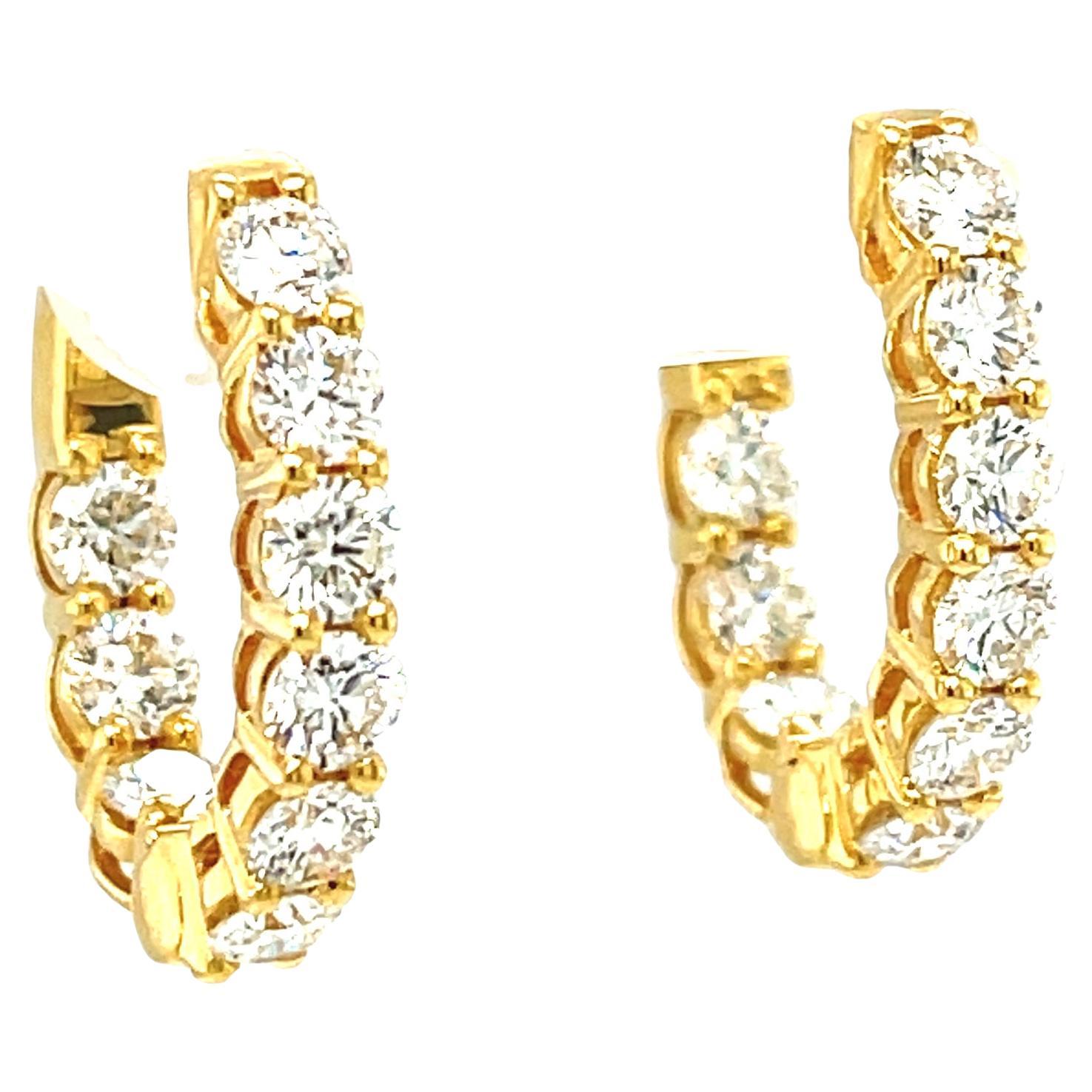 These diamond hoop earrings are set with much larger than usually seen diamonds, which gives them a really impressive look. These sparkling, round brilliant-cut diamonds weigh a total of 2.31 carats.  A timeless look that is always in style, these