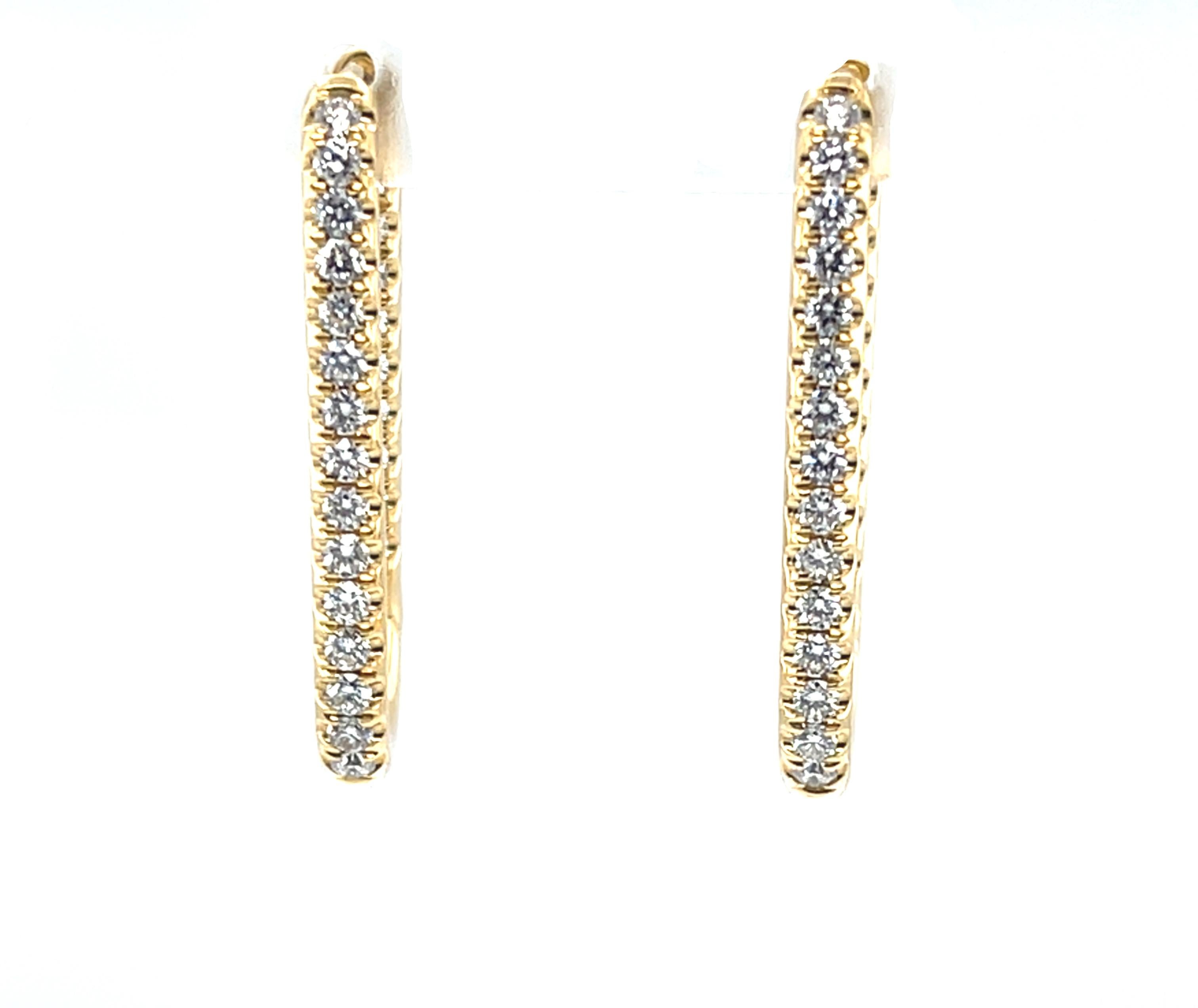 Questi bellissimi orecchini in oro giallo 18 carati hanno .78 carati di diamanti naturali incastonati sia all'interno che all'esterno dei cerchi per un lussuoso look di diamanti infiniti! La forma ovale allungata e angolata di questi orecchini è una