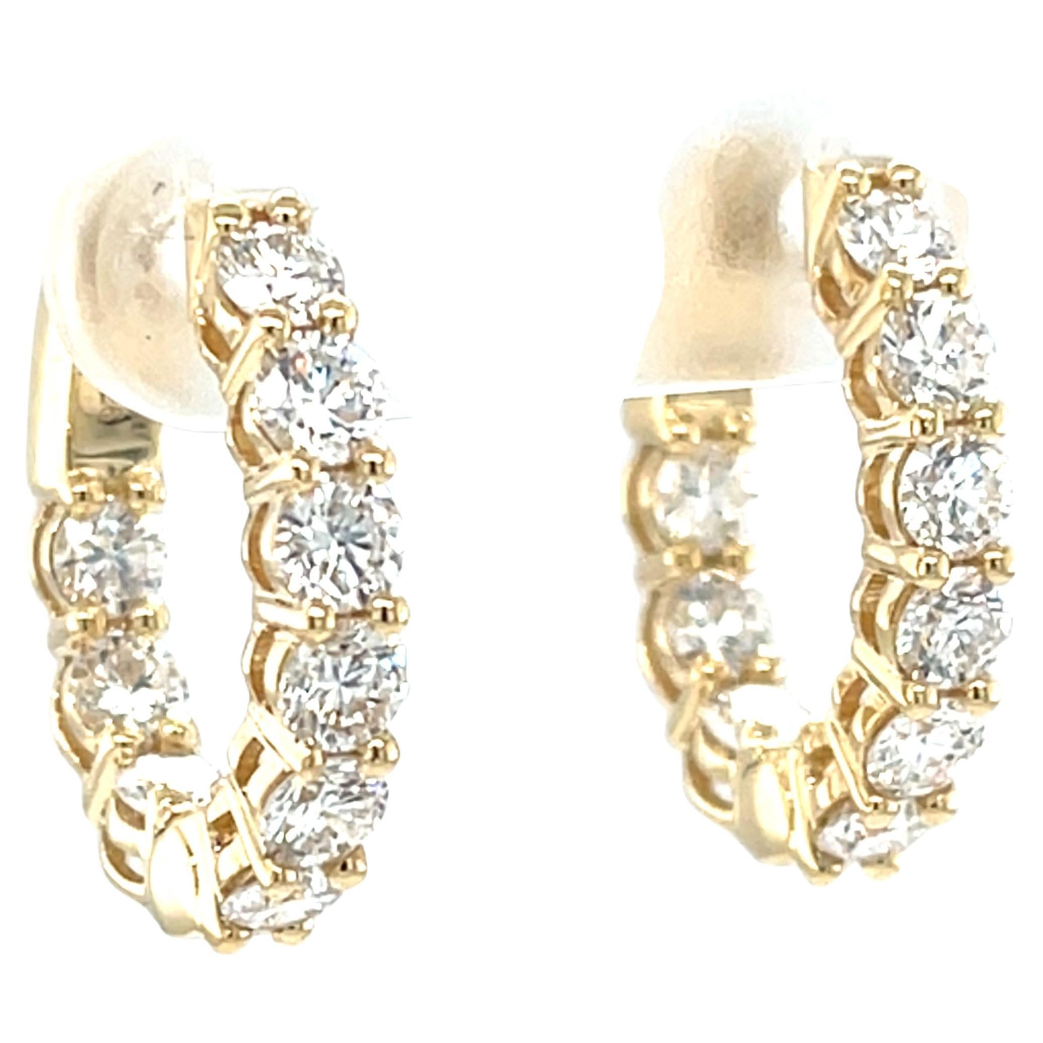 These impressive 18k yellow gold earrings feature 2.26 carats of natural brilliant cut  diamonds that are larger than those usually seen in diamond hoops! The 