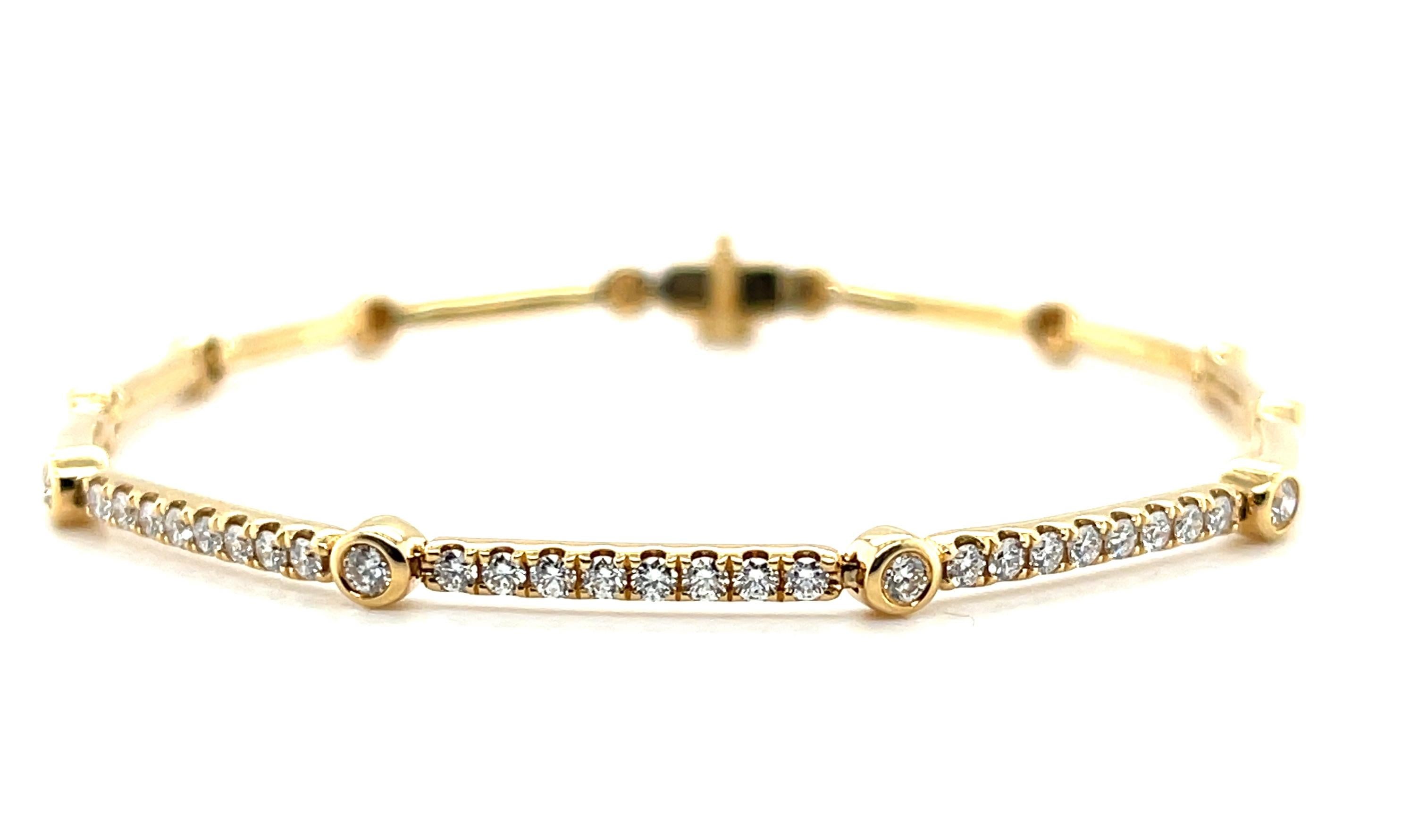 This beautiful 18k yellow gold link bracelet is set with sparkling round brilliant-cut diamonds weighing .55 carats total and is perfect for daytime and evening wear! Three of the elongated links are pave-set with elegant lines of diamonds connected