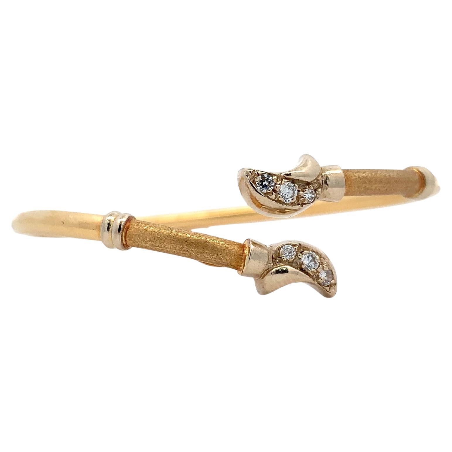 Diamond and 18k yellow gold twisted bangle bracelet