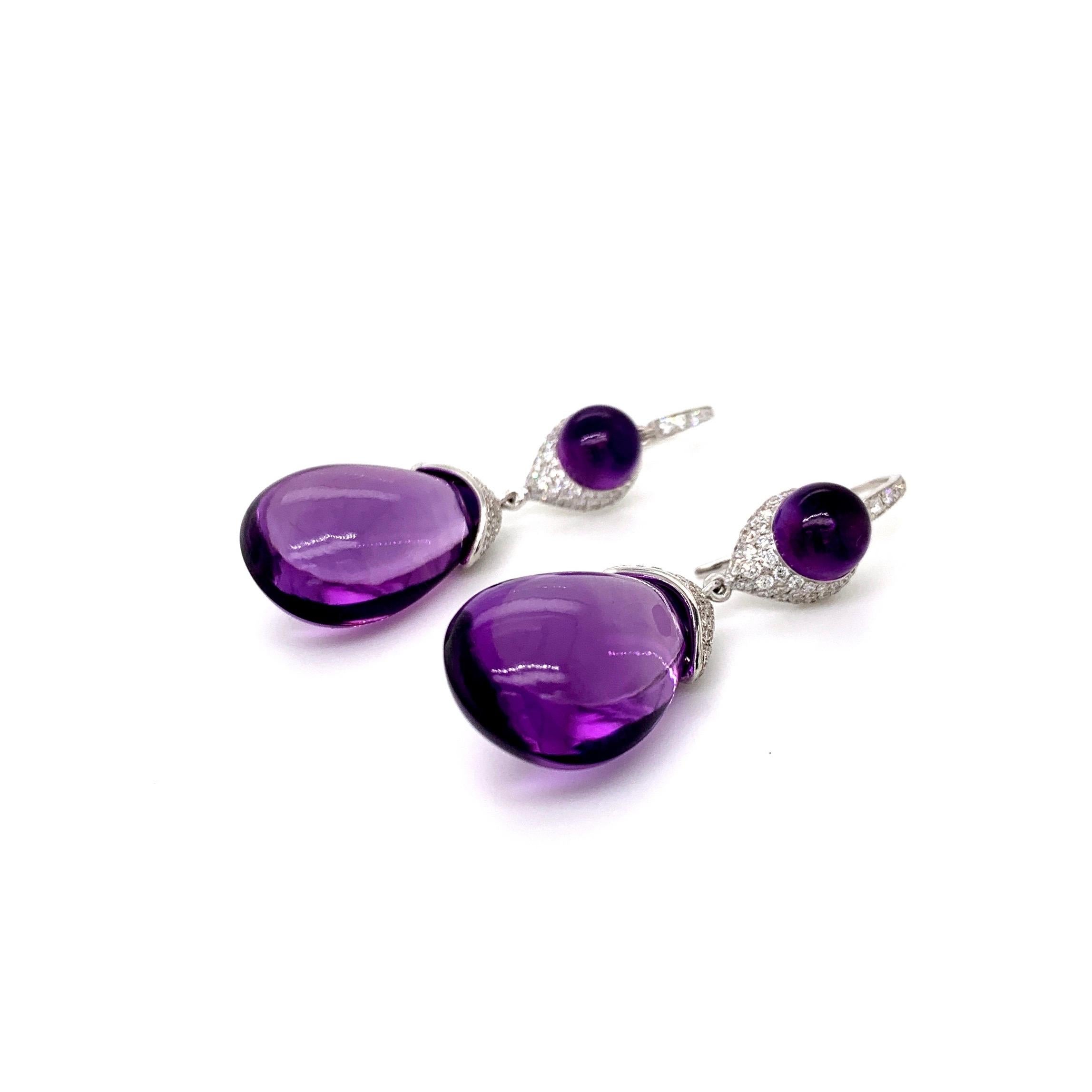 Beautiful pair of dangling diamond earrings with stunning amethyst drops.
Amethyst is a powerful and protective stone. Amethyst activates spiritual awareness, opens intuition and enhances psychic abilities. It has strong healing and cleansing