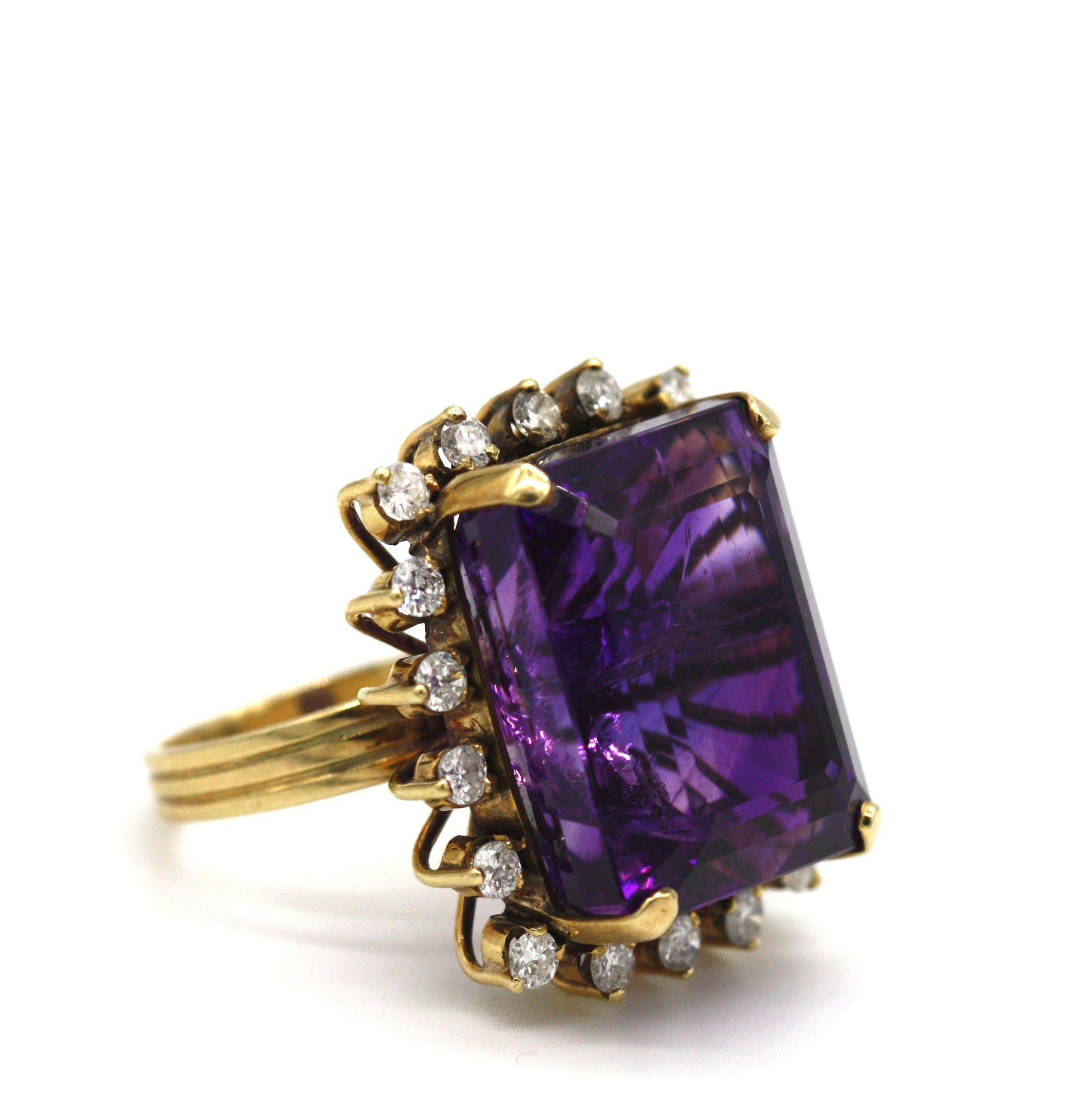Diamond and Amethyst Ring
Centered with an emerald-cut amethyst measuring approximately 16 x 21 mm, surrounded by round cut diamonds weighing approximately 0.90 carats, mounted in 14 karat yellow gold, gross weight 16.4 grams, ring size 7.5
