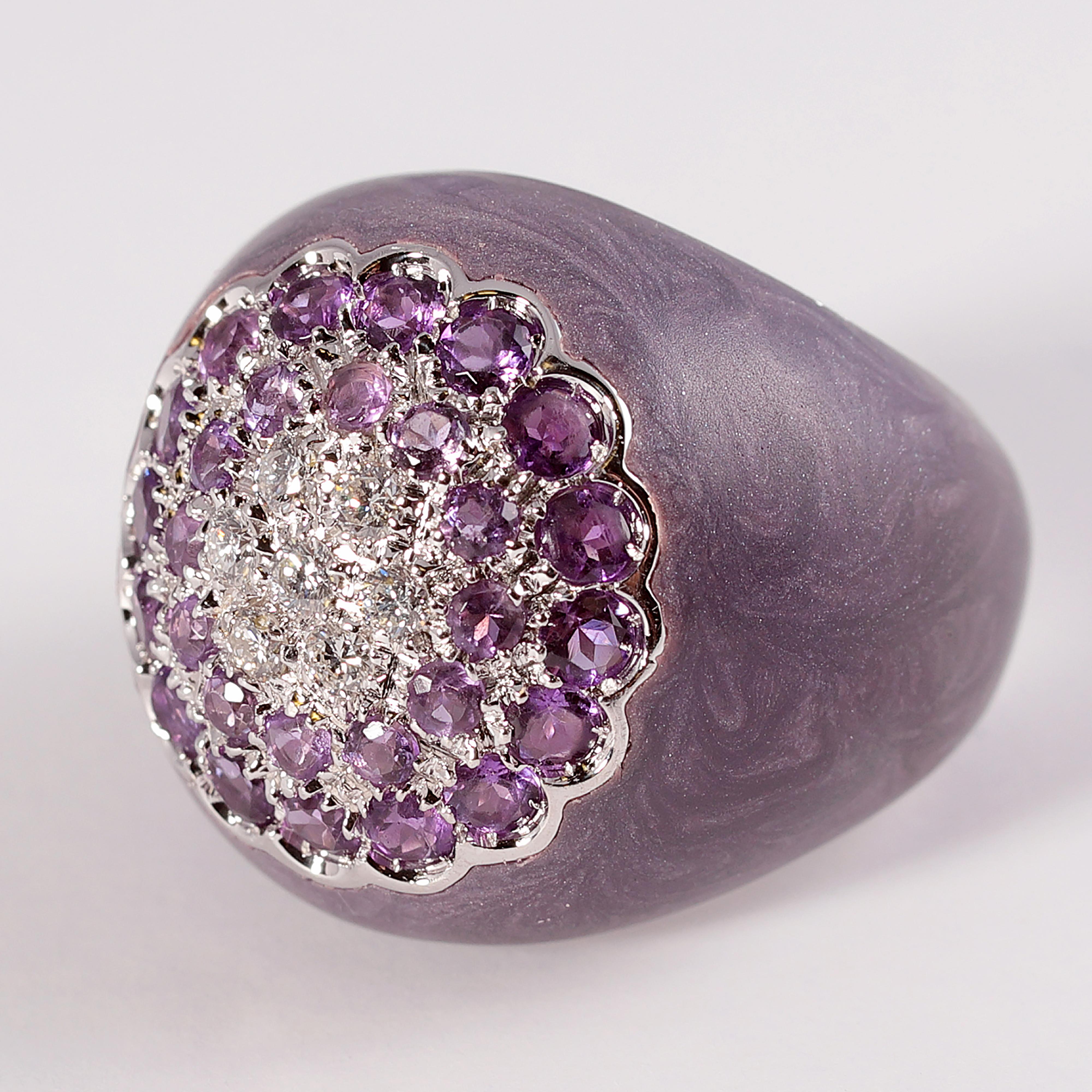 18 Karat ring from Bonato & Massoni of Milan with 0.25 carats of pave set diamonds and amethysts with a floral motif.  The stones sit atop a dome of swirled purple and silver enamel.  This unusual piece is quite a conversation starter.  Size 7.