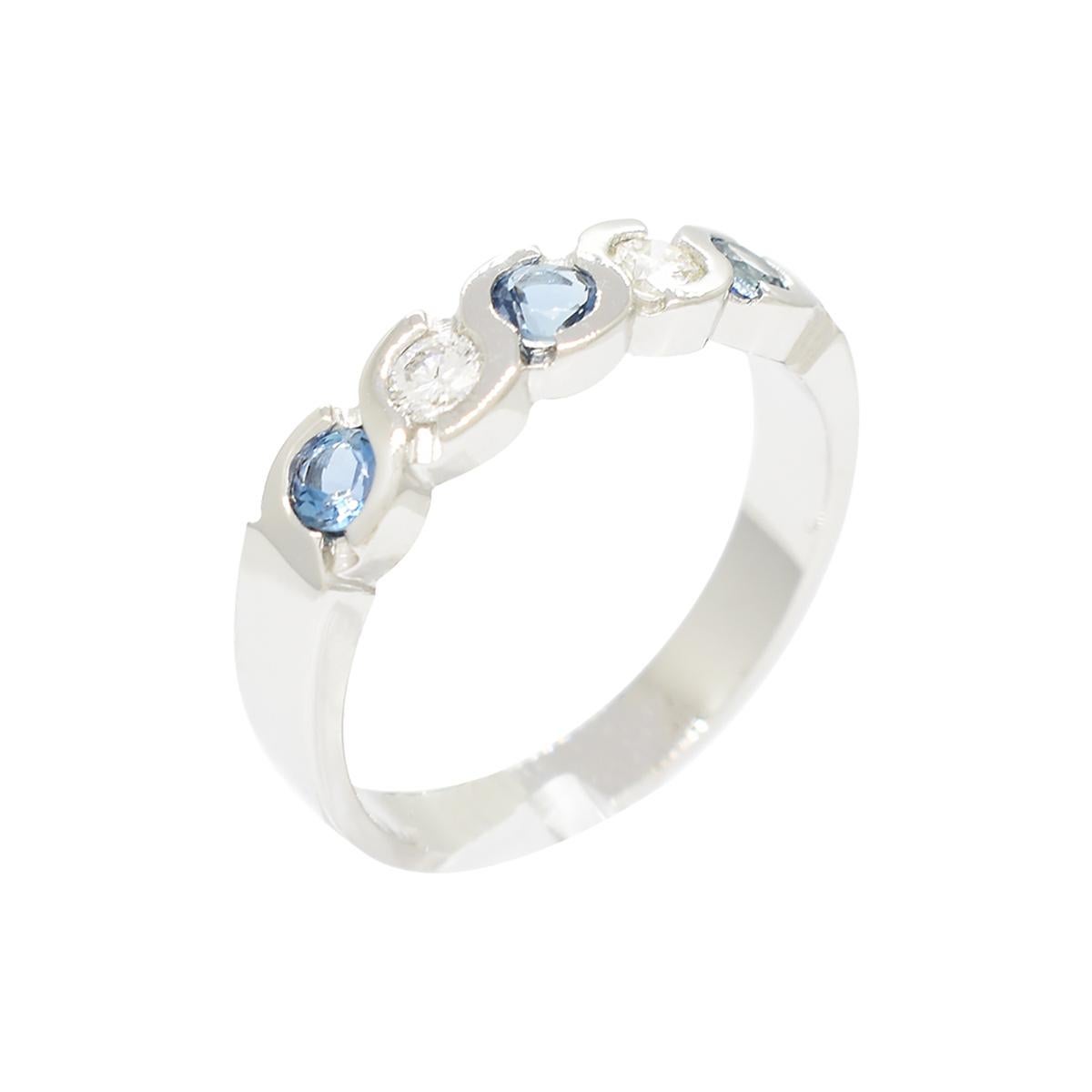 Wonderful aquamarine and diamond ring band with a stunning selection of 3 natural aquamarines and 2 genuine diamonds, all beautifully set in a solid 18K white gold ring design. The stunning blue color of the round cut aquamarines and gorgeous