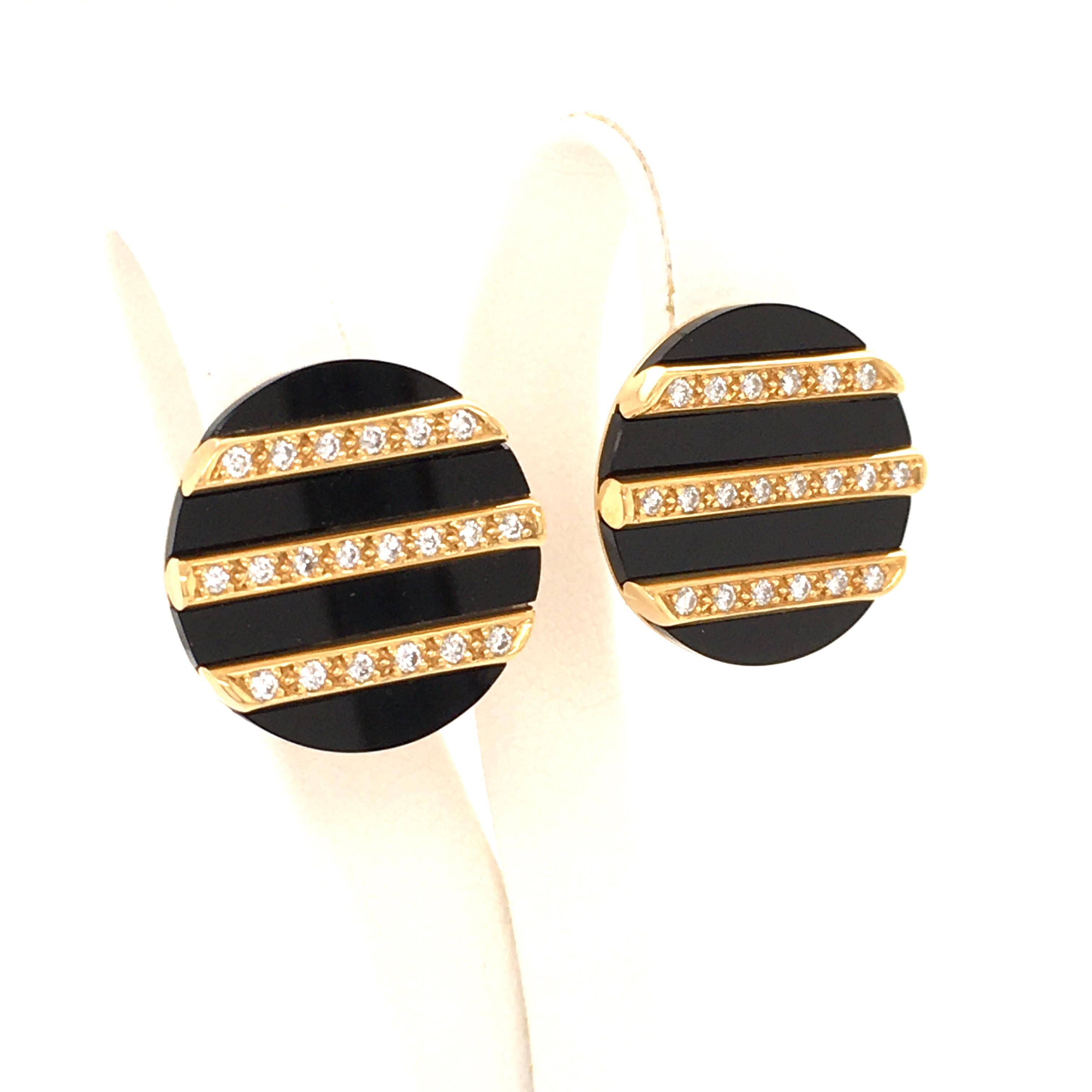 These sleek and modern earclips in 18 karat yellow gold feature an attractive mix of black chalcedony and sparkling diamonds. Three straight gold lines on each clip are set with a total of 40 brilliant cut diamonds of G/H color and vs clarity, total