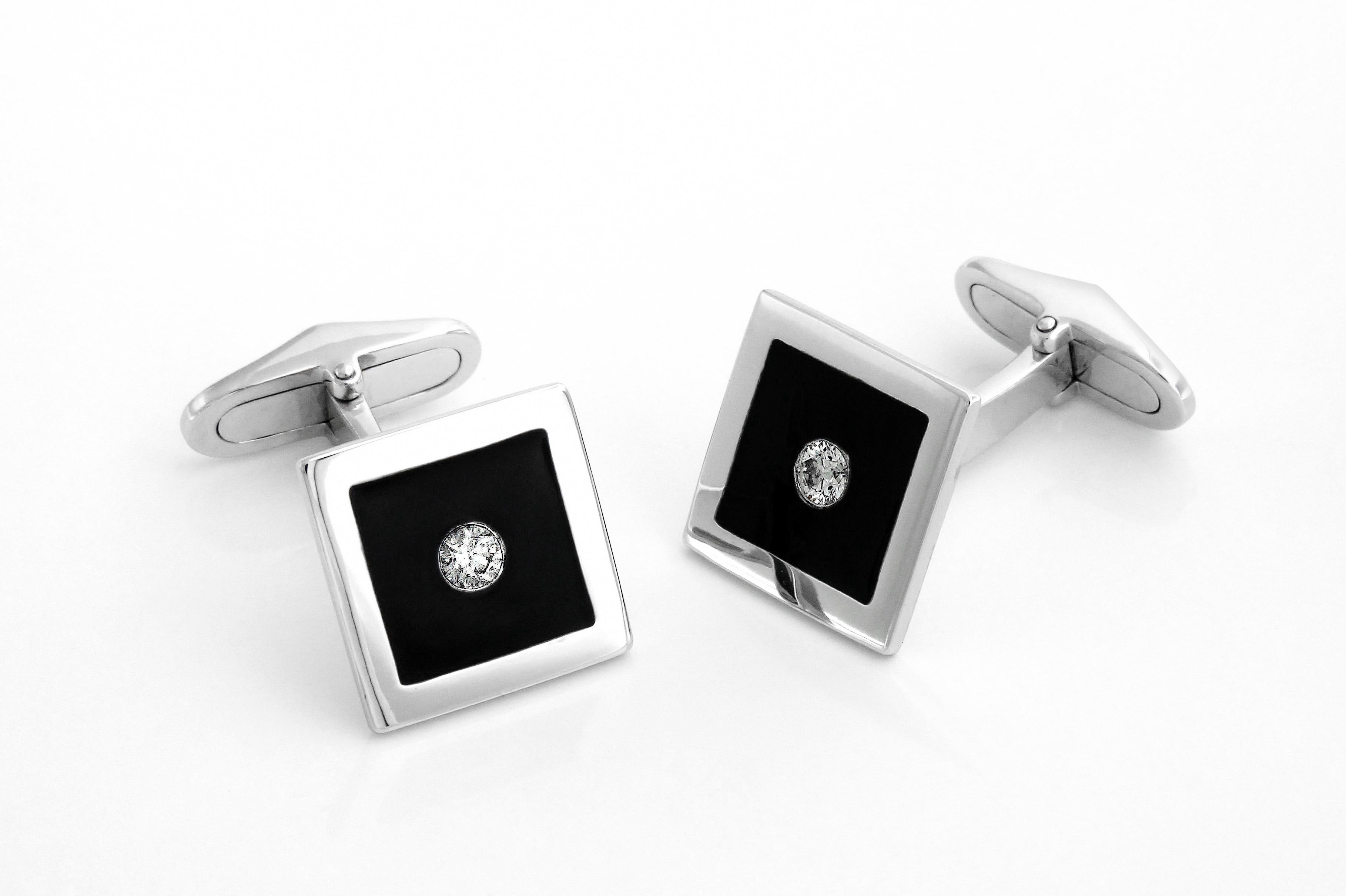These enamel and diamond cufflinks were created for the sophiscated gent who loves to dress up but not be over stated. Made in 18k gold and set with two diamonds, they are the perfect accessory for the stylish man about town.
