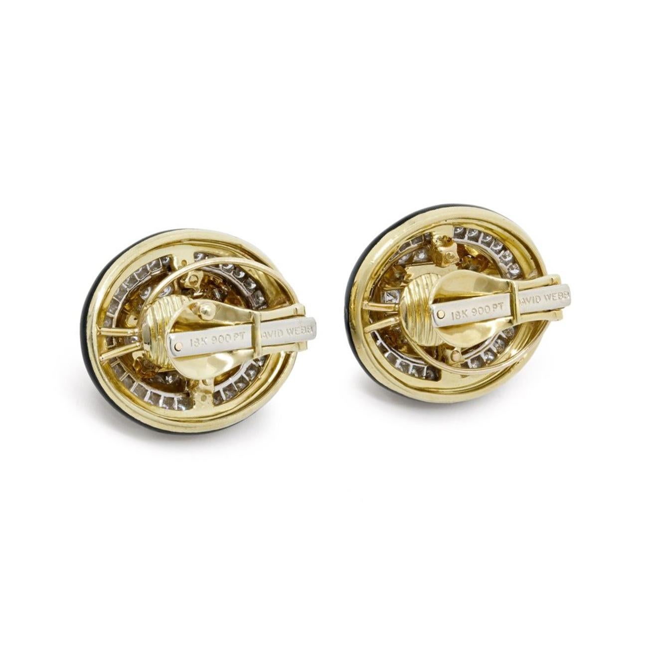 Platinum, 18K Yellow gold black enamel earrings with diamonds by David Webb. Oval 2 Tiered Domes with Black Enamel Borders and Center Portions.

Platinum and 18K yellow gold
4.06 ctw F-G/VS1-SI1 round brilliant diamonds