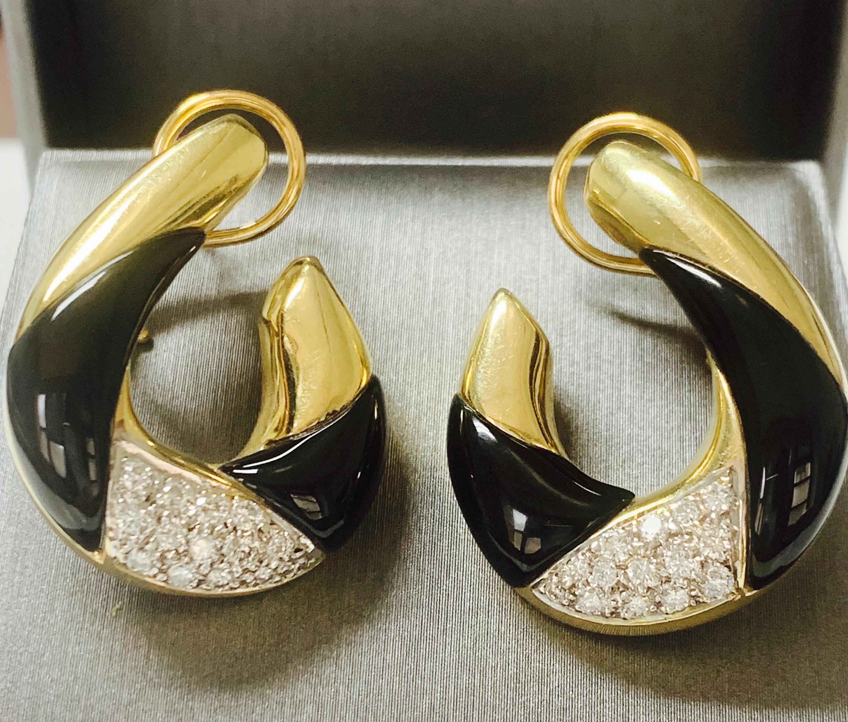 Beautiful diamond and black onyx earrings are hand crafted in 14 k yellow gold. 
The details are as follows : 

Diamond weight : 0.85 carat 
Metal : 14 k yellow gold 
Measurements : 1 1/4 inch by 1 inch 

