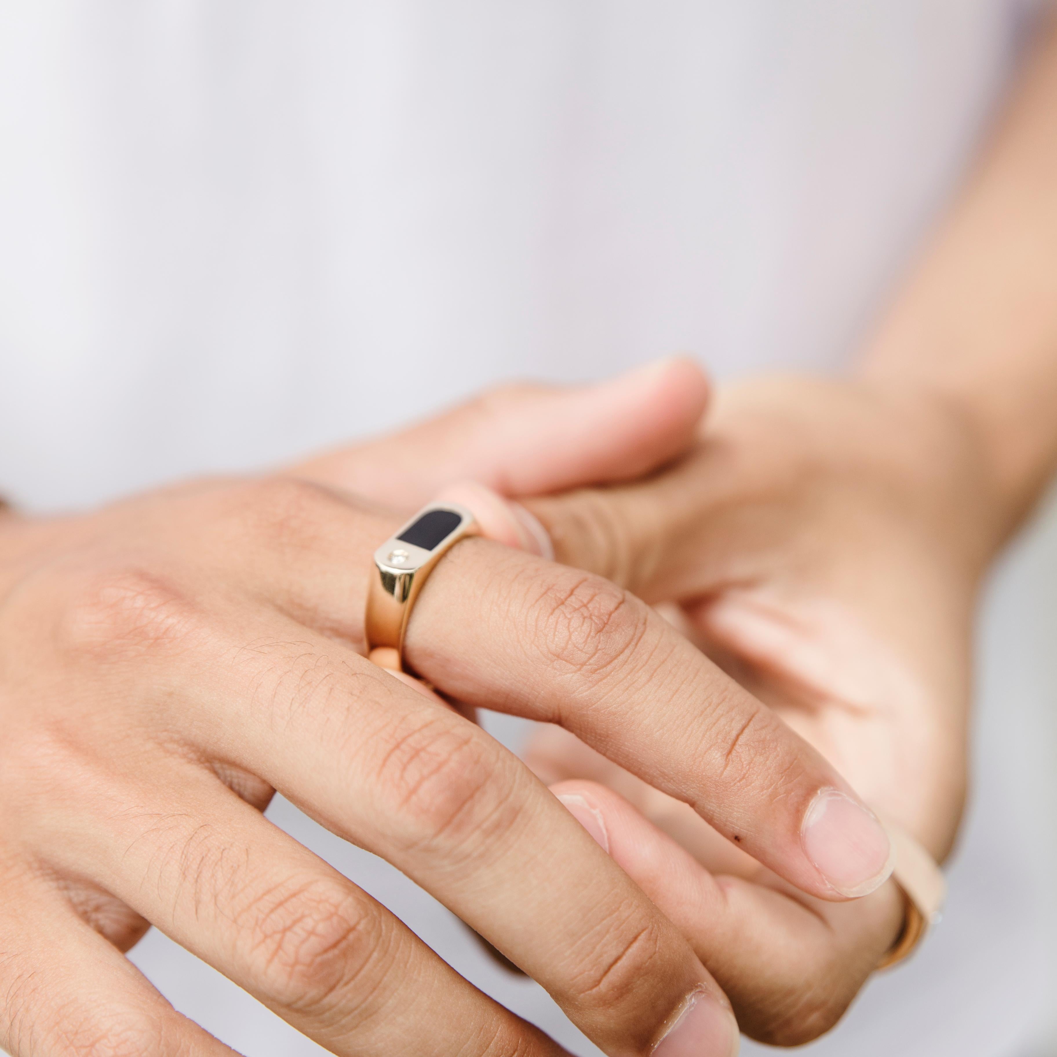 signet ring on pointer finger