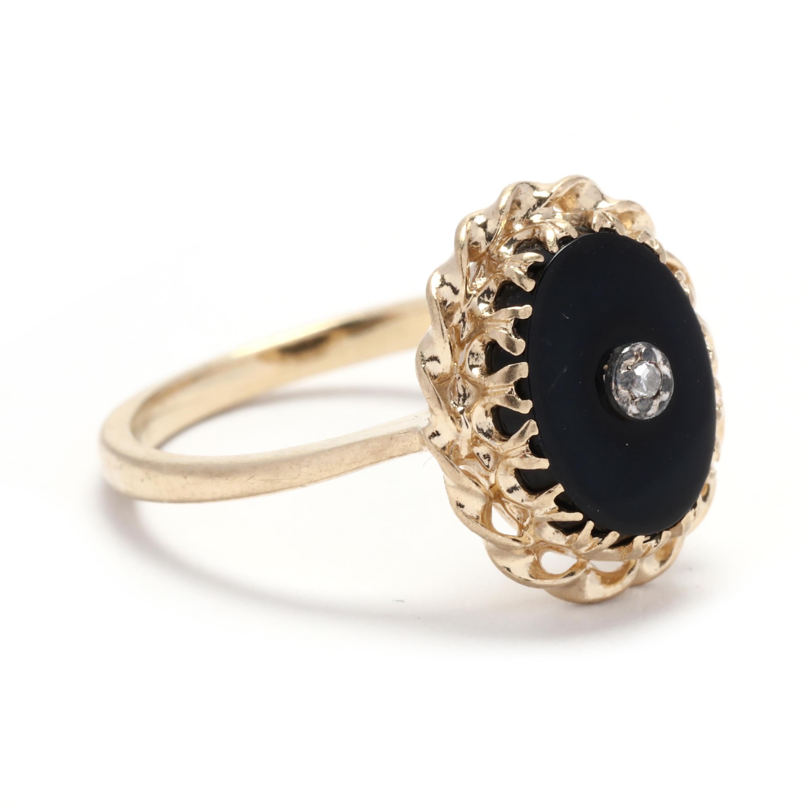 Crafted in 10K yellow gold, this ring features a stunning oval-shaped black onyx stone. The deep black color of the onyx creates a striking contrast against the yellow gold, adding a dramatic touch to the overall design. This ring is available in a