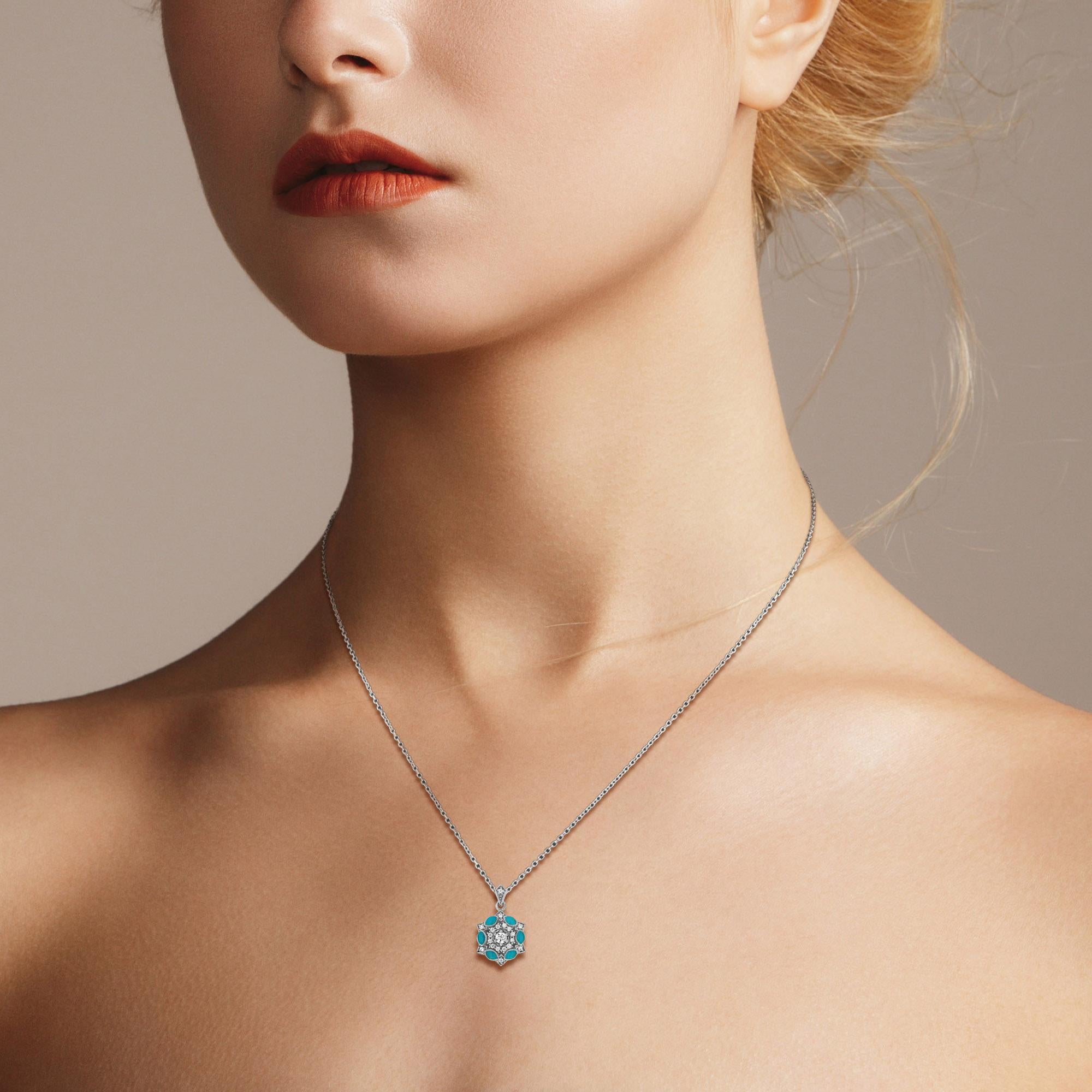 The Diamond and Enamel Art Deco Style Floral Cluster Pendant in 14K White Gold is a symbol of love’s enduring embrace. A vibrant Diamond takes center stage, surrounded by shimmering diamonds in a delicate floral design, radiating elegance and