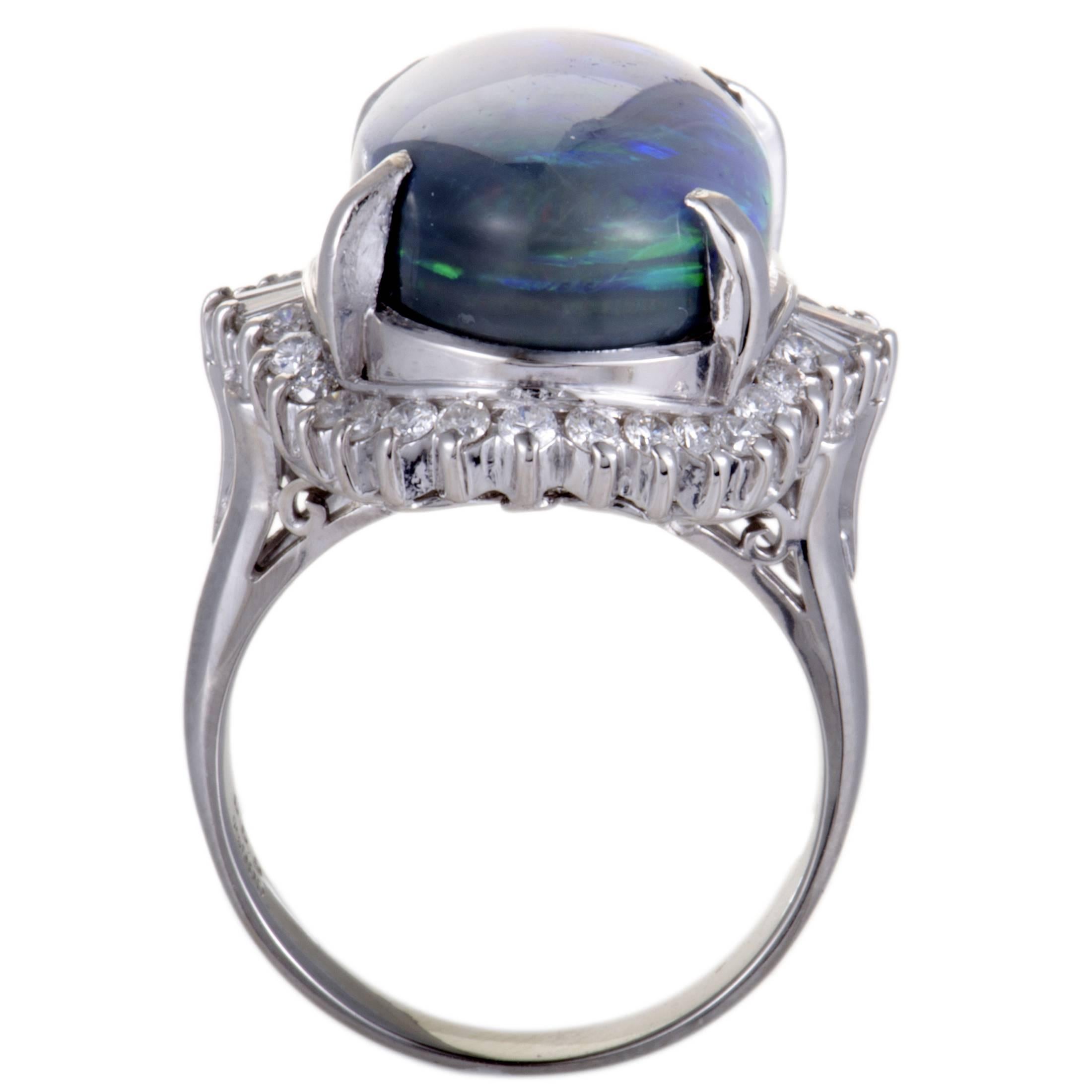 The prestigious gleam of platinum and the alluring glisten of dazzling diamonds, weighing 0.69ct, produce an incredibly luxurious effect in this gorgeous ring. The glamorous ring also features a sensational blue opal of 11.58ct that immensely