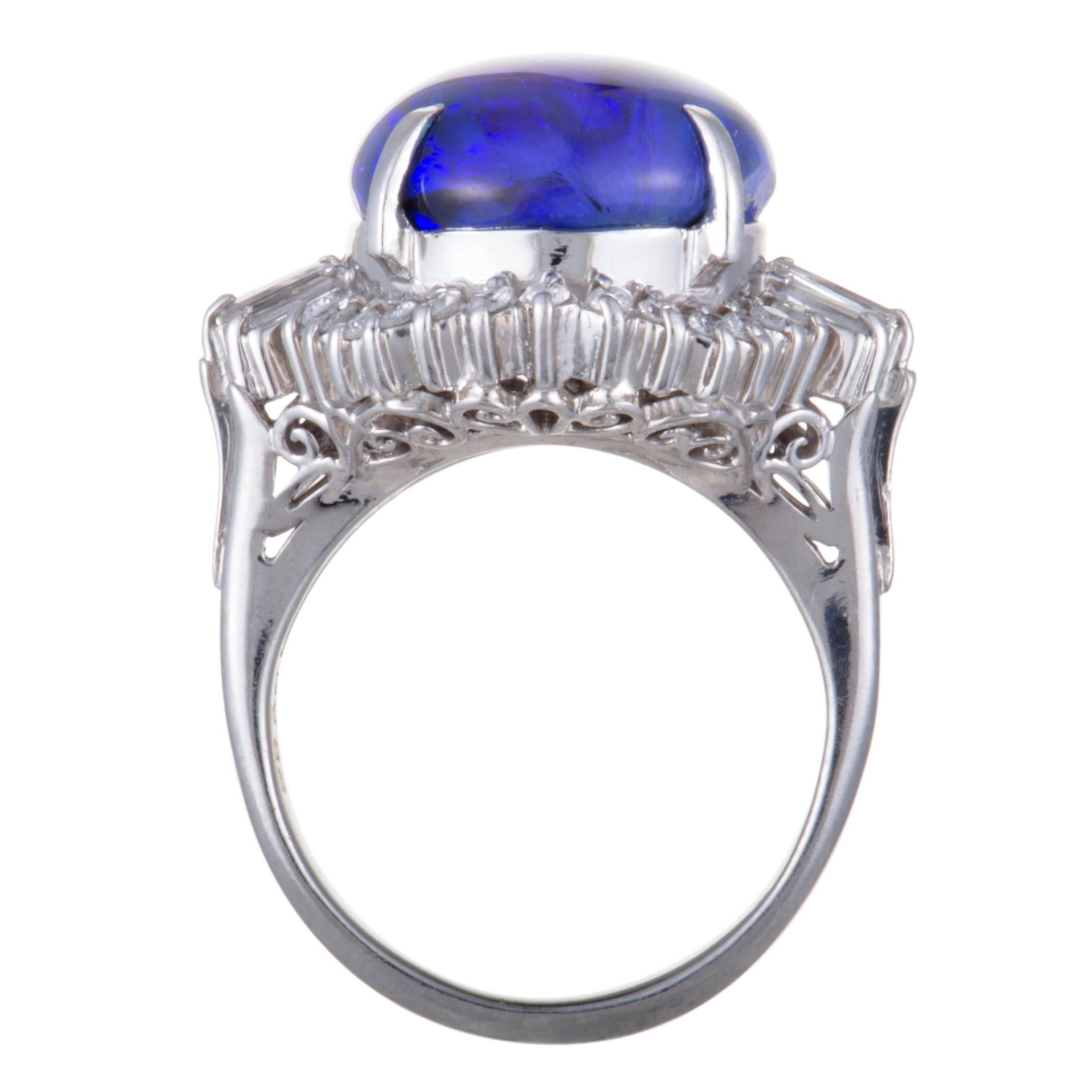An attractive pop of color is given to this fashionable ring by the eye-catching blue opal that takes the central place, accompanied by a plethora of glamorously glistening diamonds. The ring is made of platinum and boasts a total of 0.82 carats of
