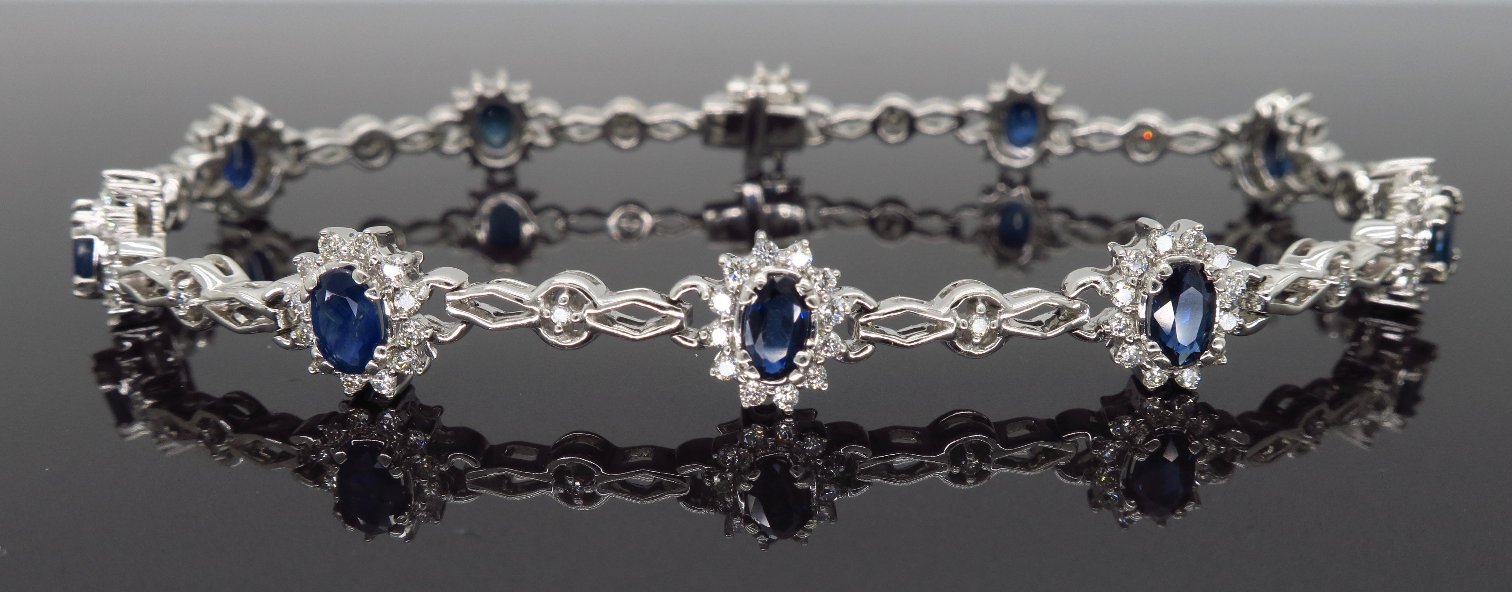 This stunning bracelet features 2.65CTW of oval cut blue sapphires surrounded by approximately 1.05CTW of Round Brilliant Cut Diamonds.

Gemstone: Sapphire & Diamond
Gemstone Carat Weight: 10 Oval Cut Blue Sapphires, 2.65CTW 
Diamond Cut: Round