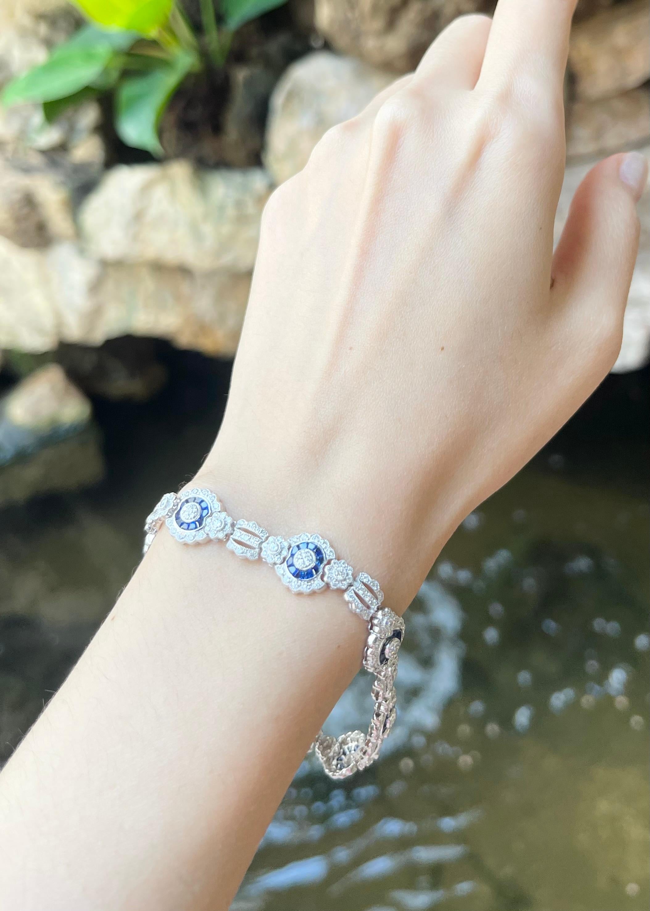 Diamond 2.29 carats and Blue Sapphire 2.20 carats Bracelet set in 18K White Gold Settings

Width: 1.1 cm 
Length: 18.5 cm
Total Weight: 15.69 grams

