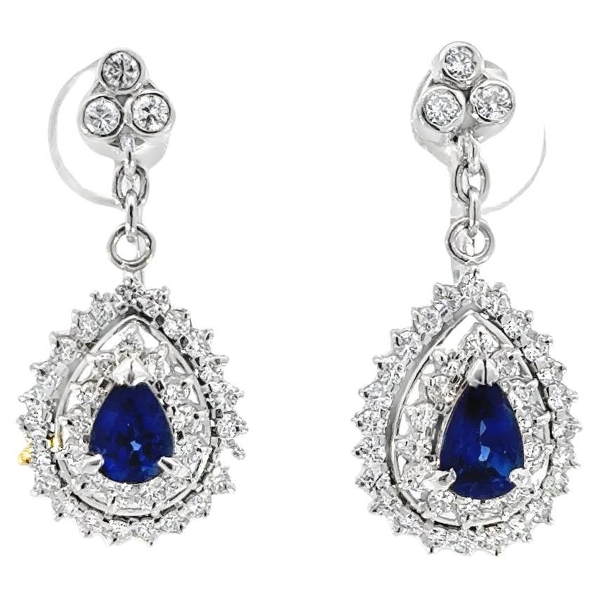 Diamond and Blue Sapphire Dangling Earrings in Platinum