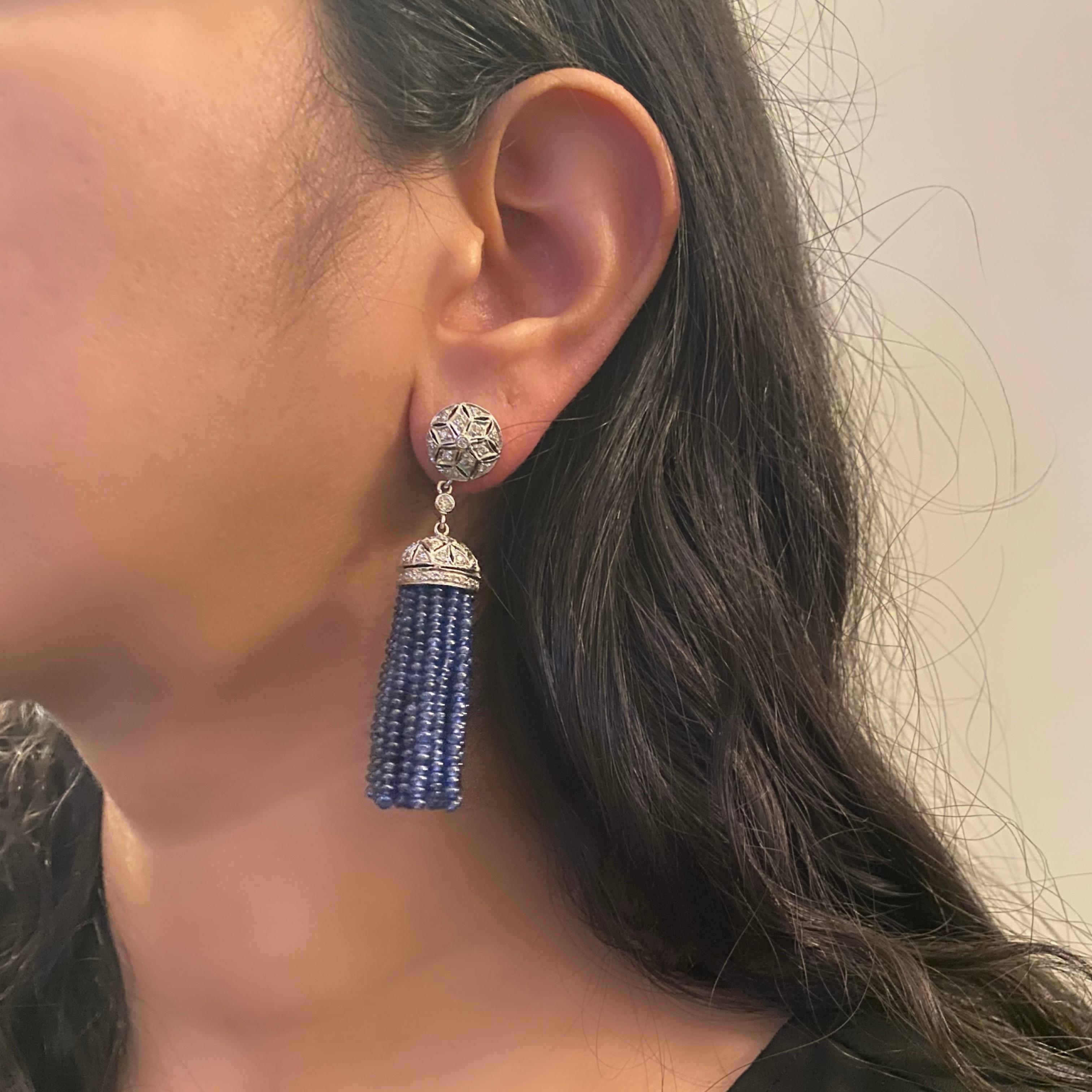 Introducing our exquisite Diamond and Blue Sapphire Drop Earring in 18 Karat White Gold, a symbol of elegance and sophistication. These stunning earrings are a true showcase of timeless beauty and the perfect blend of diamonds and blue