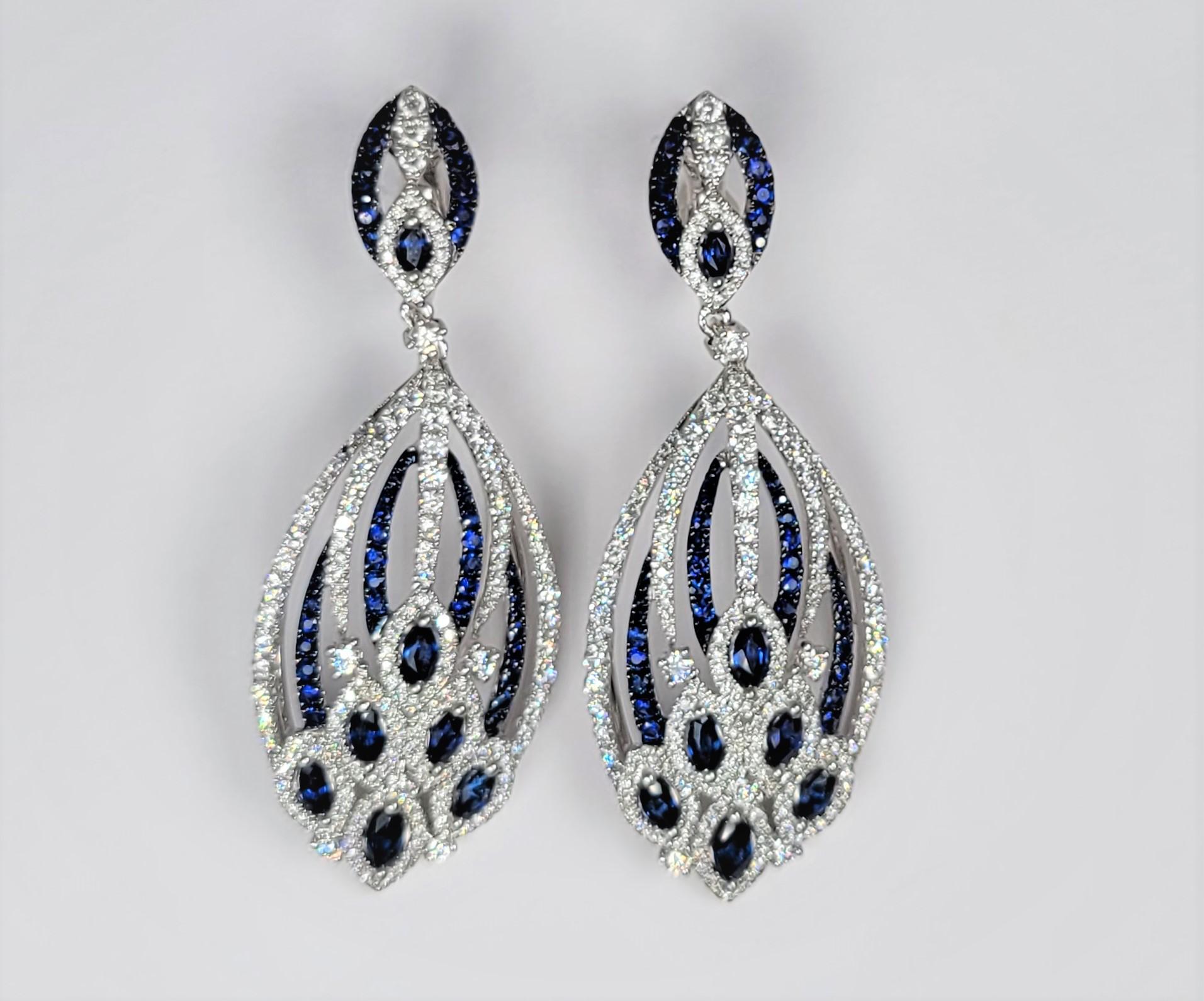 Stunning diamond and blue sapphire earrings in 18 karat white gold.  Black rhodium accentuates the blue sapphires.  Stamped LTJ.