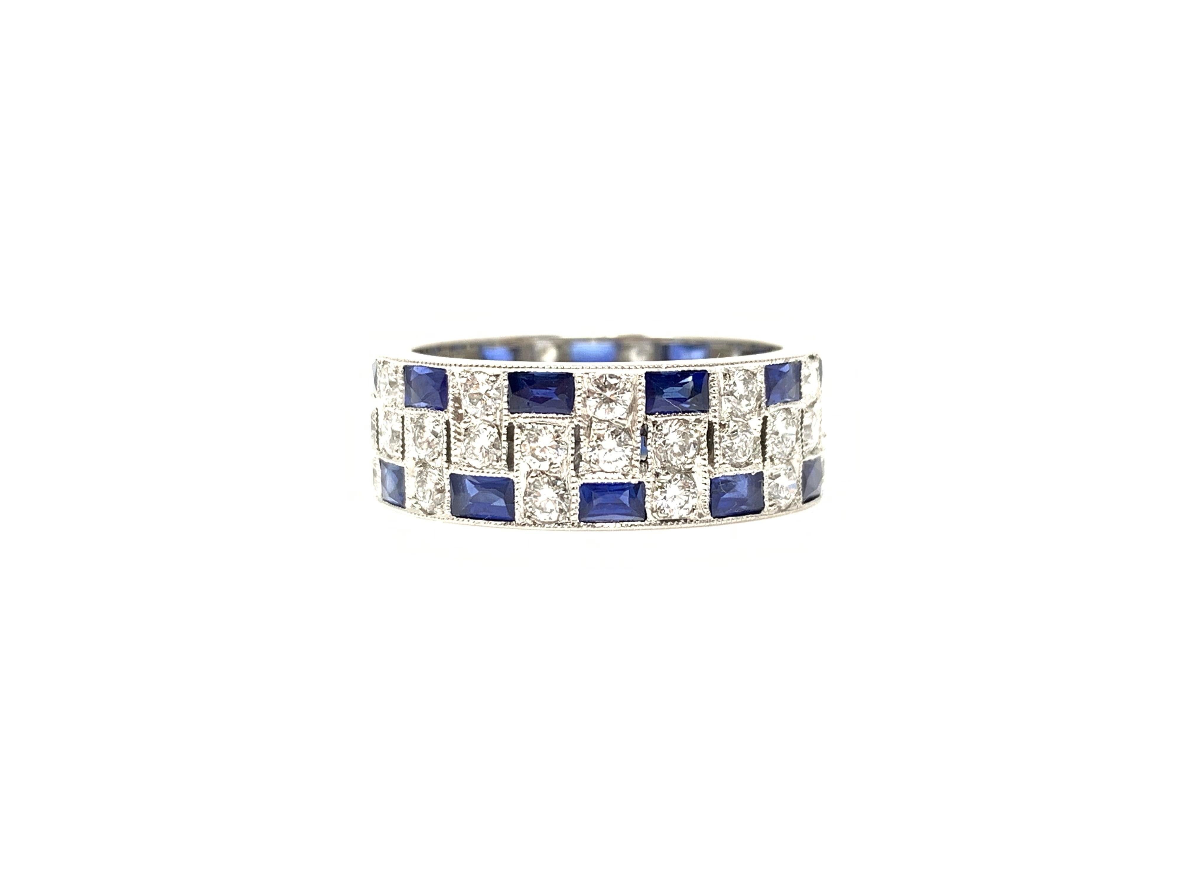 This unique eternity band is set with white diamonds and beautiful blue sapphire baguettes. The extremely well hand crafted platinum mounting has white diamonds weighing 1.81 carat with GH color and VS clarity and blue sapphire baguettes weighing