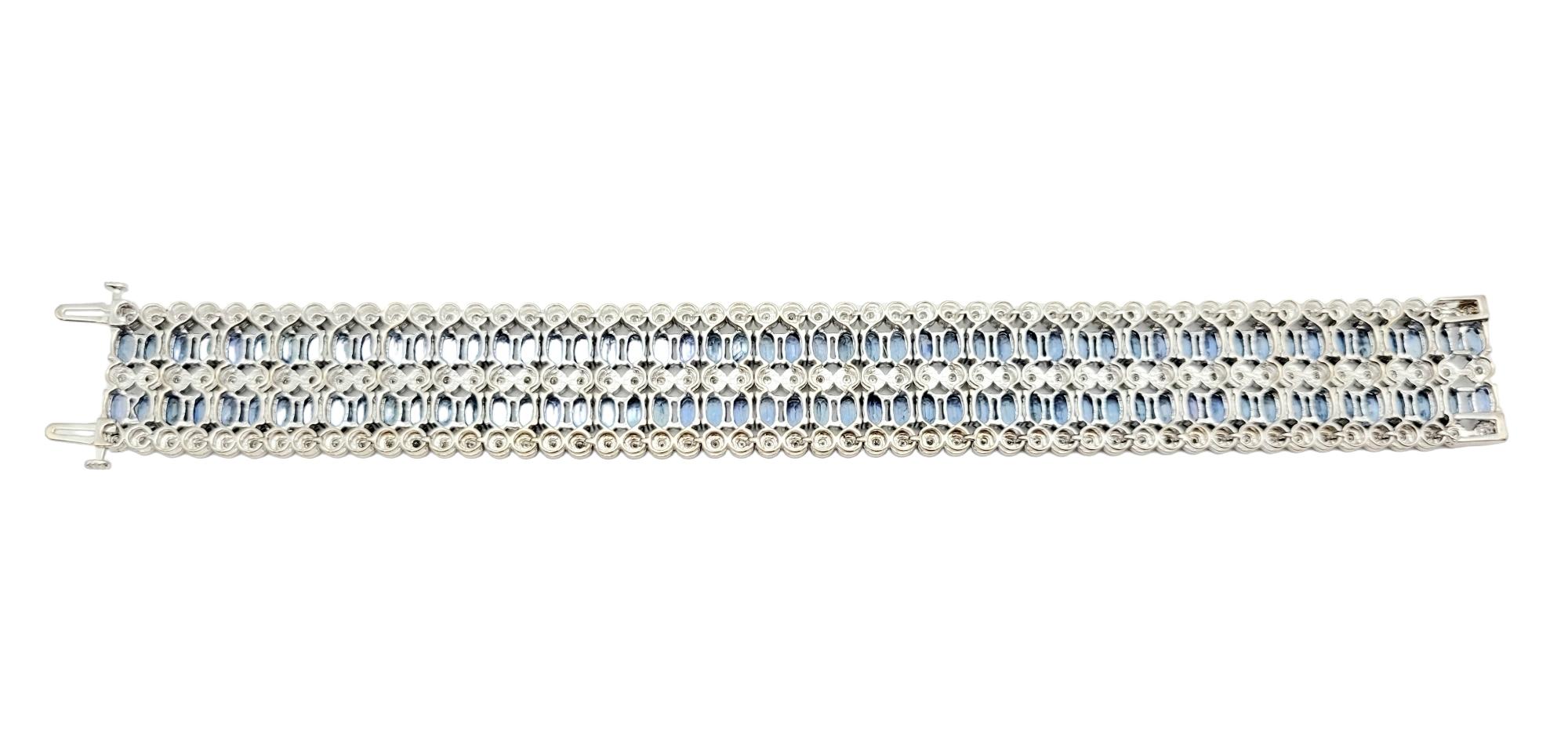 Taille ovale Bracelet manchette à plusieurs rangées de diamants et saphirs bleus en or blanc 14 carats en vente