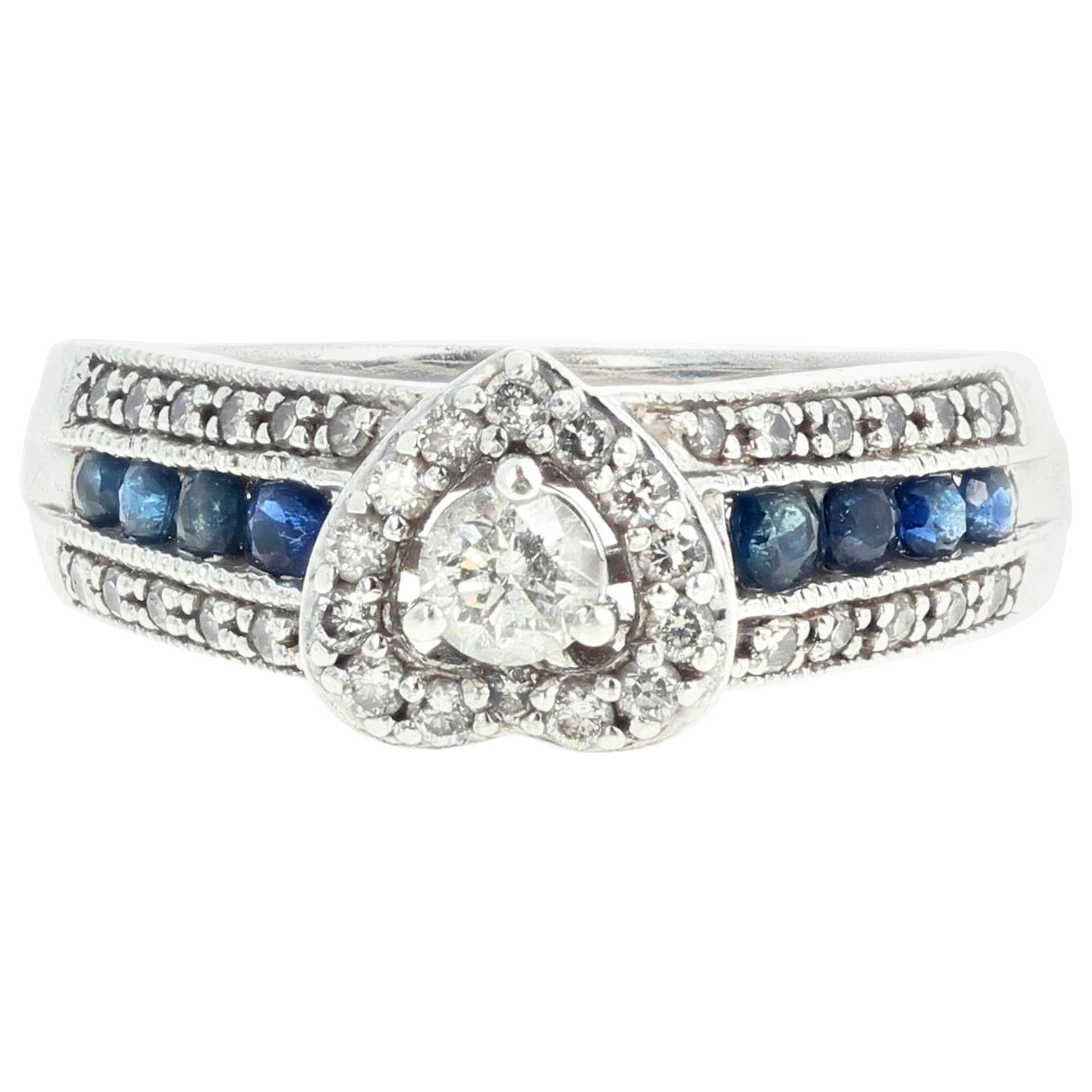 AJD Delicate Eye-Catching Diamond and Blue Sapphire Platinaire Ring