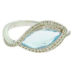 Diamond and Blue Topaz Swivel Eye Shape White Gold Ring