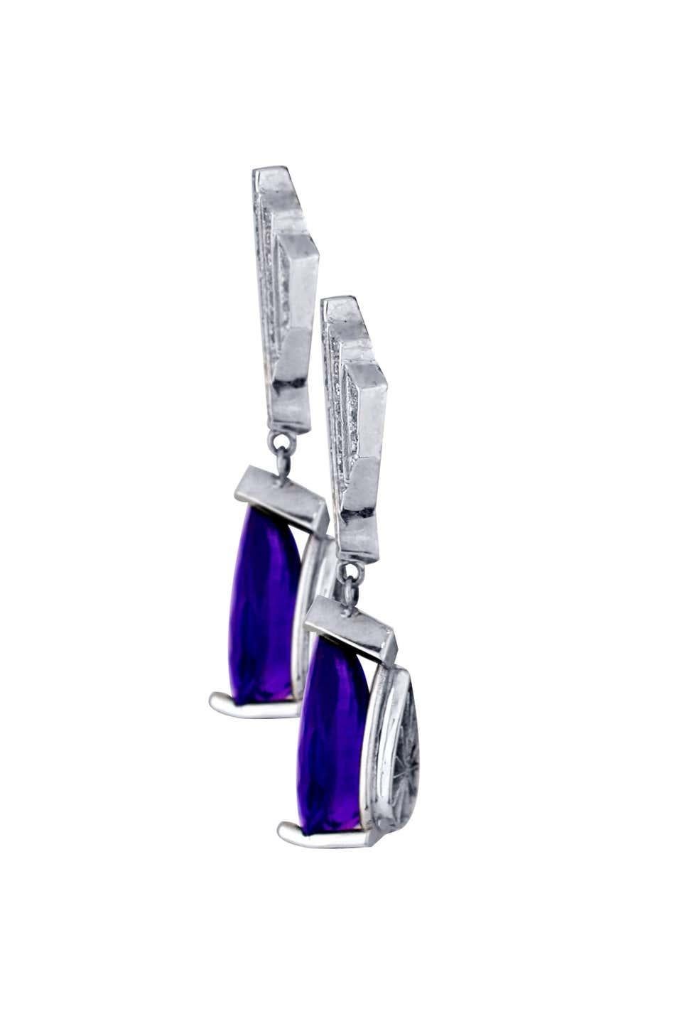 Art Deco, Diamond Amethyst Drop Earrings measuring 1-3/4 inches in total length.

Custom Drop earrings consists of pear-shaped amethyst measuring 16.46 x 8.32 x 6.50 mm.
 Weight of the 2-stones are 9 carats. 
The origin are Brazilian. Color is deep