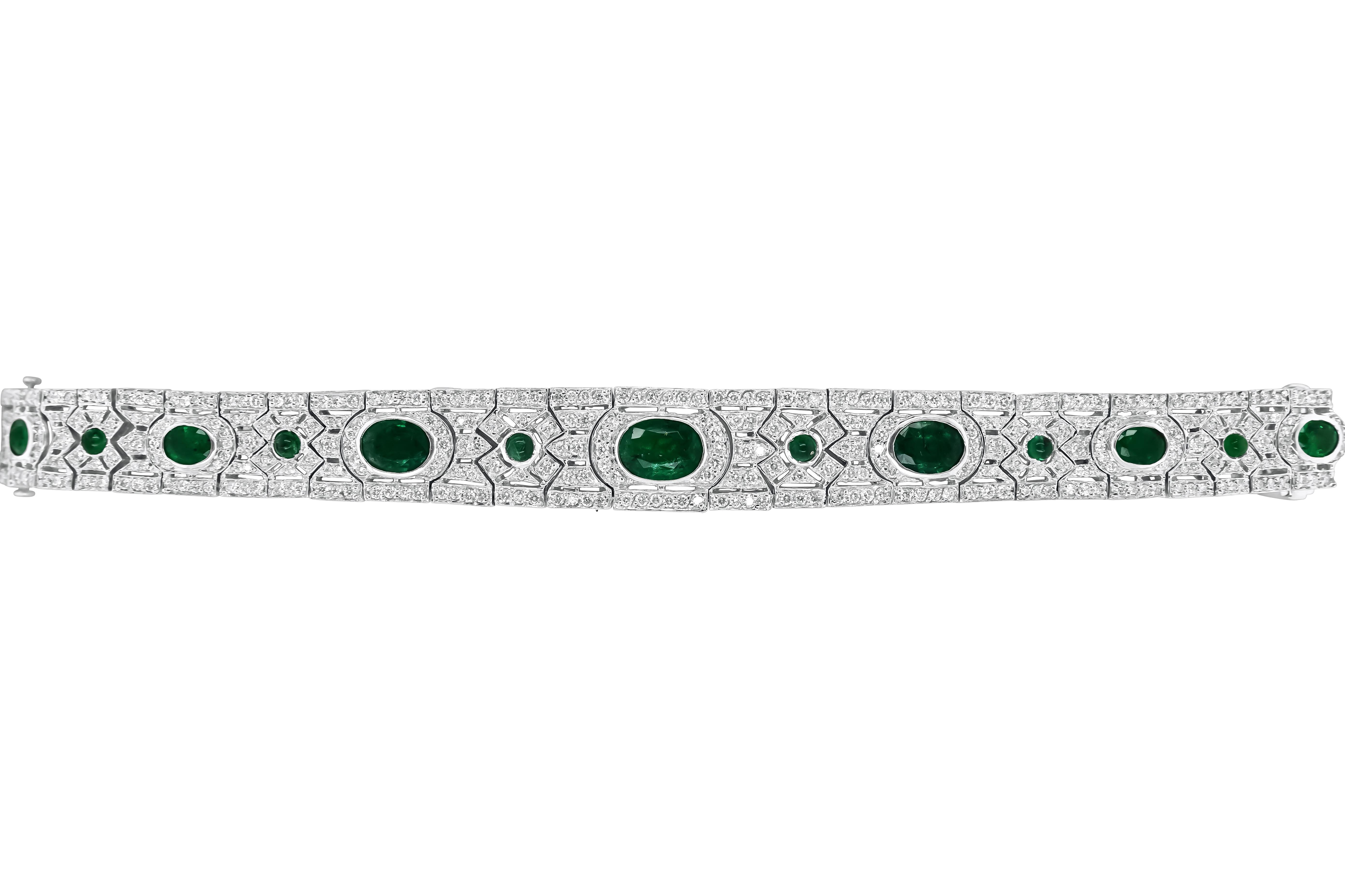 Original Magnum Creations design, features 4.29 carats of white diamonds, 1.19 carats of cabochon emeralds, and 7.64 carats of emeralds all around the bracelet, mounted on a 18 karats white gold casting. 

This one-of-a-kind Art Deco style bracelet