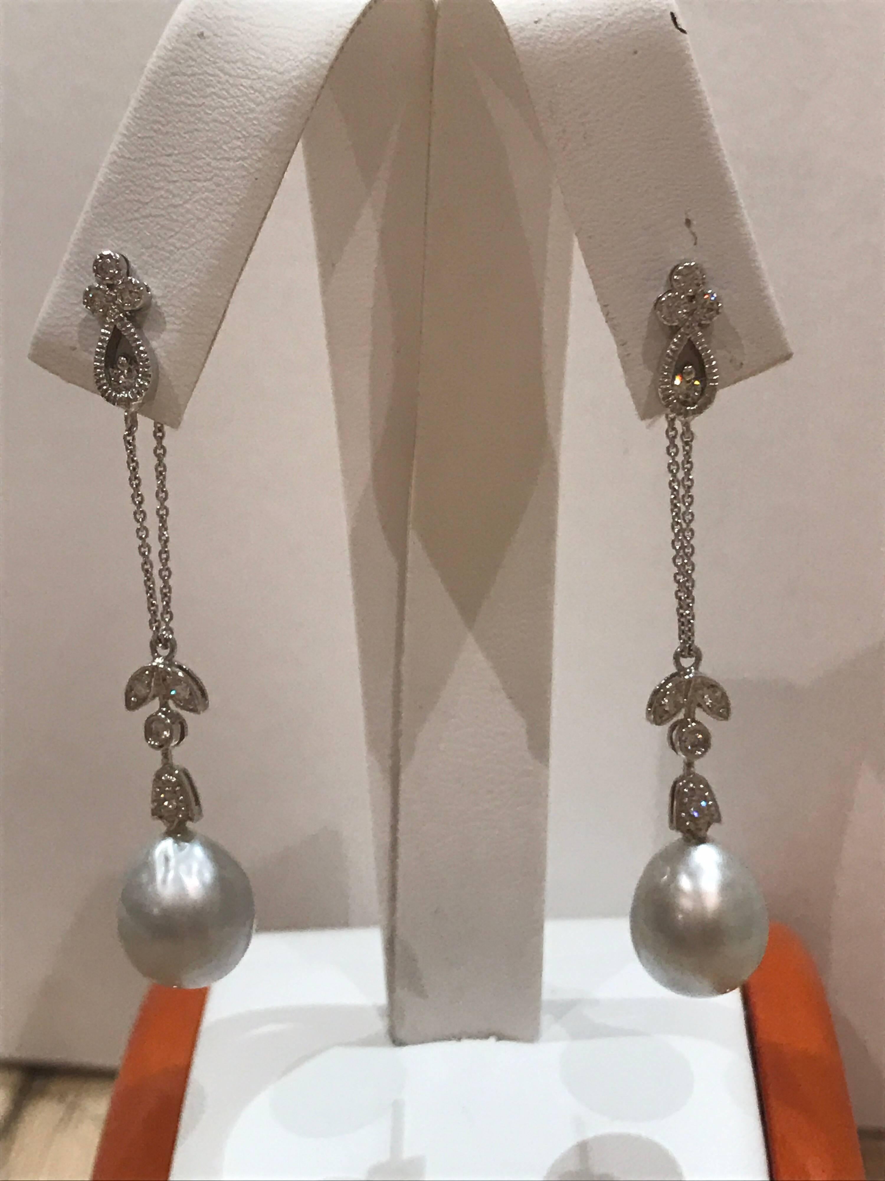 18k gold diamond and cultured pearl long drop earrings, diamond VS1/2 E/F colour and estimate 0.3ct