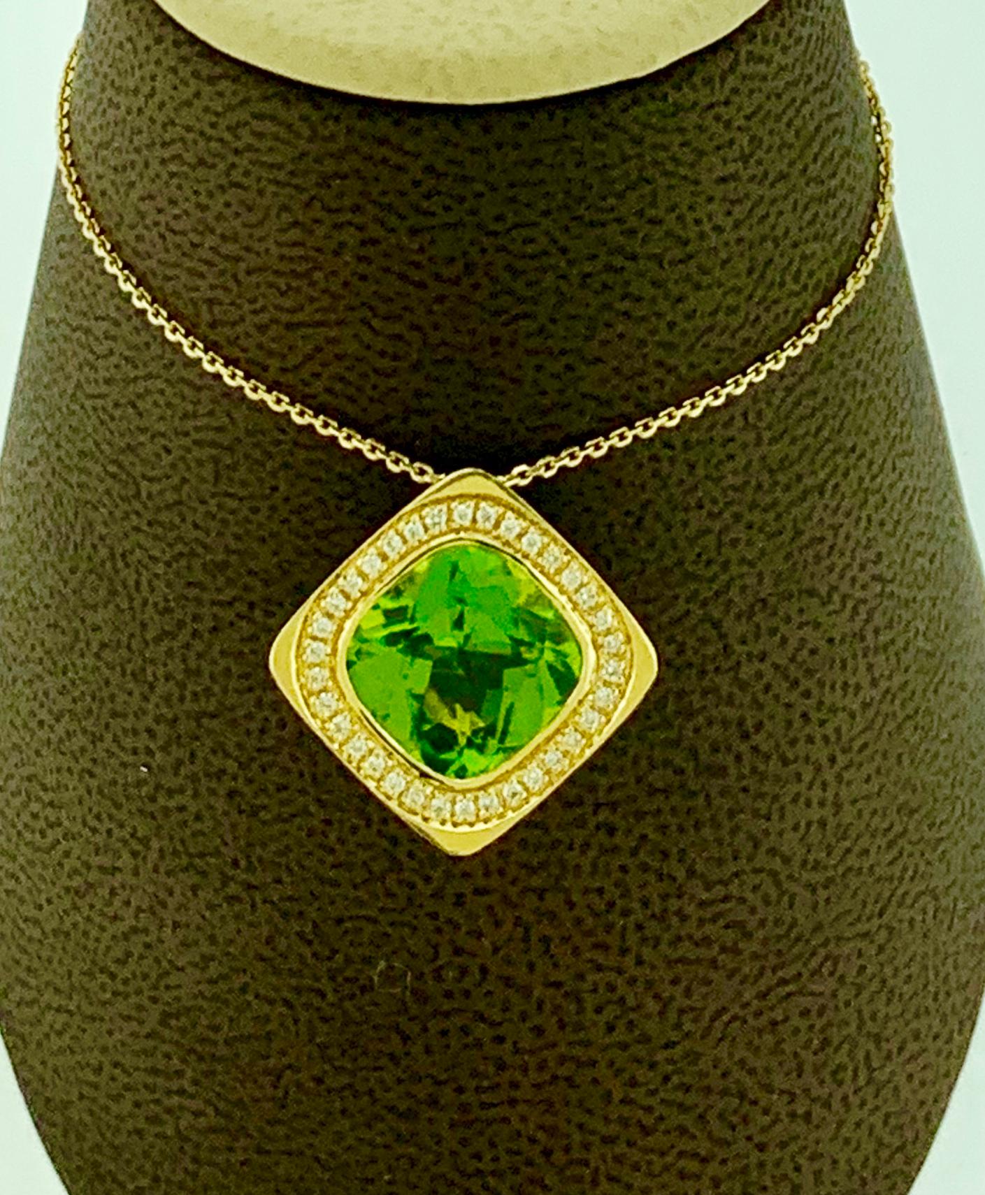  Contemporary  Diamond And  Cushion Shape Natural Peridot  Pendant Necklace 14 Karat Yellow Gold
This spectacular Pendant Necklace  consisting of a single  Cushion Shape Peridot approximately 6.5 Carat.  The  Peridot   is surrounded by 34 brilliant