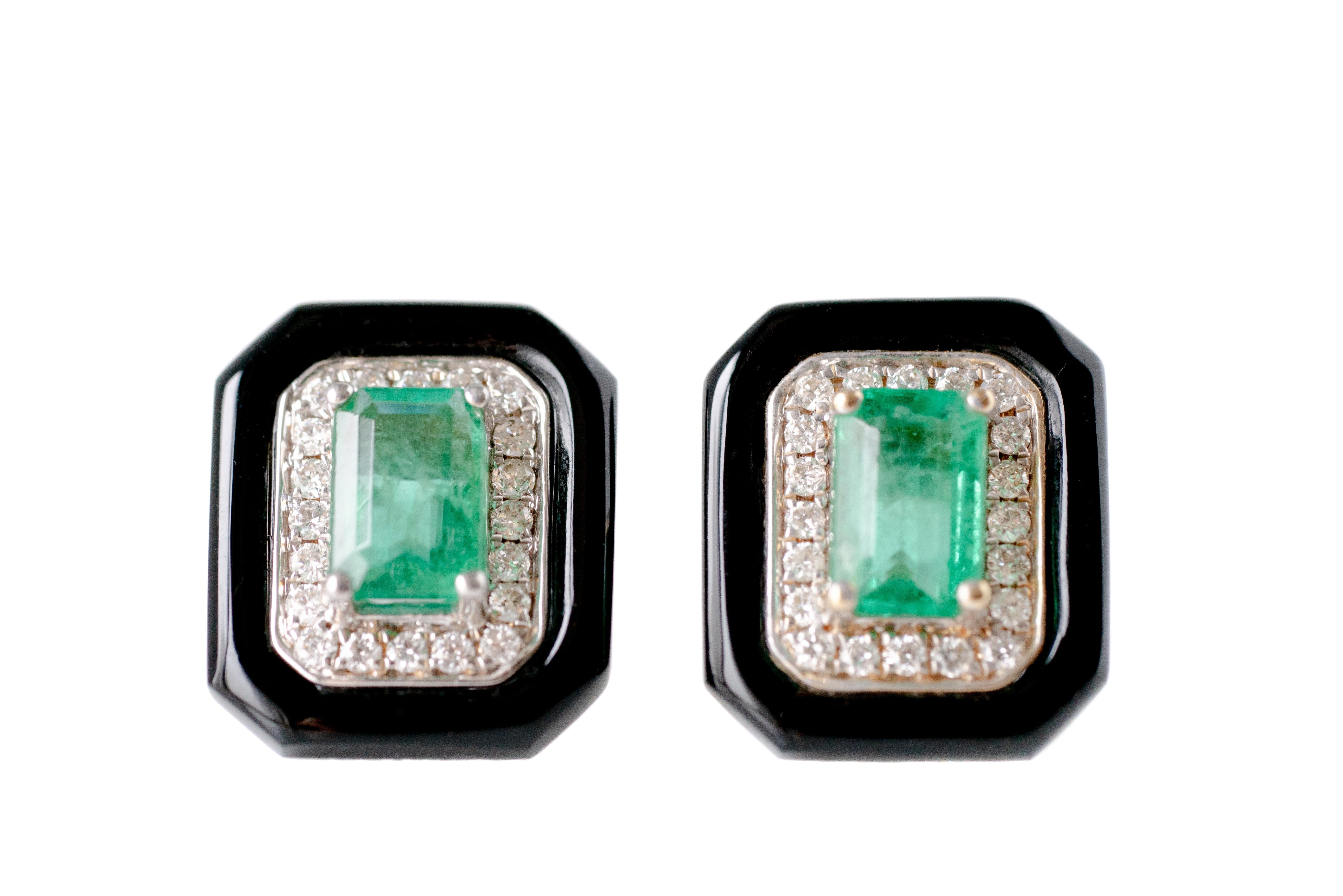 Art Deco-Inspired Emerald Earring Studs - 14 karat White Gold, Yellow Gold, Diamonds, Emerald, Onyx

Features:
Art Deco-Inspired Design
Round Brilliant Diamond Halo
Onyx Outer Frame
Prong Set Stones
Fresh and Modern Look

Earring Details:
Metal: 14