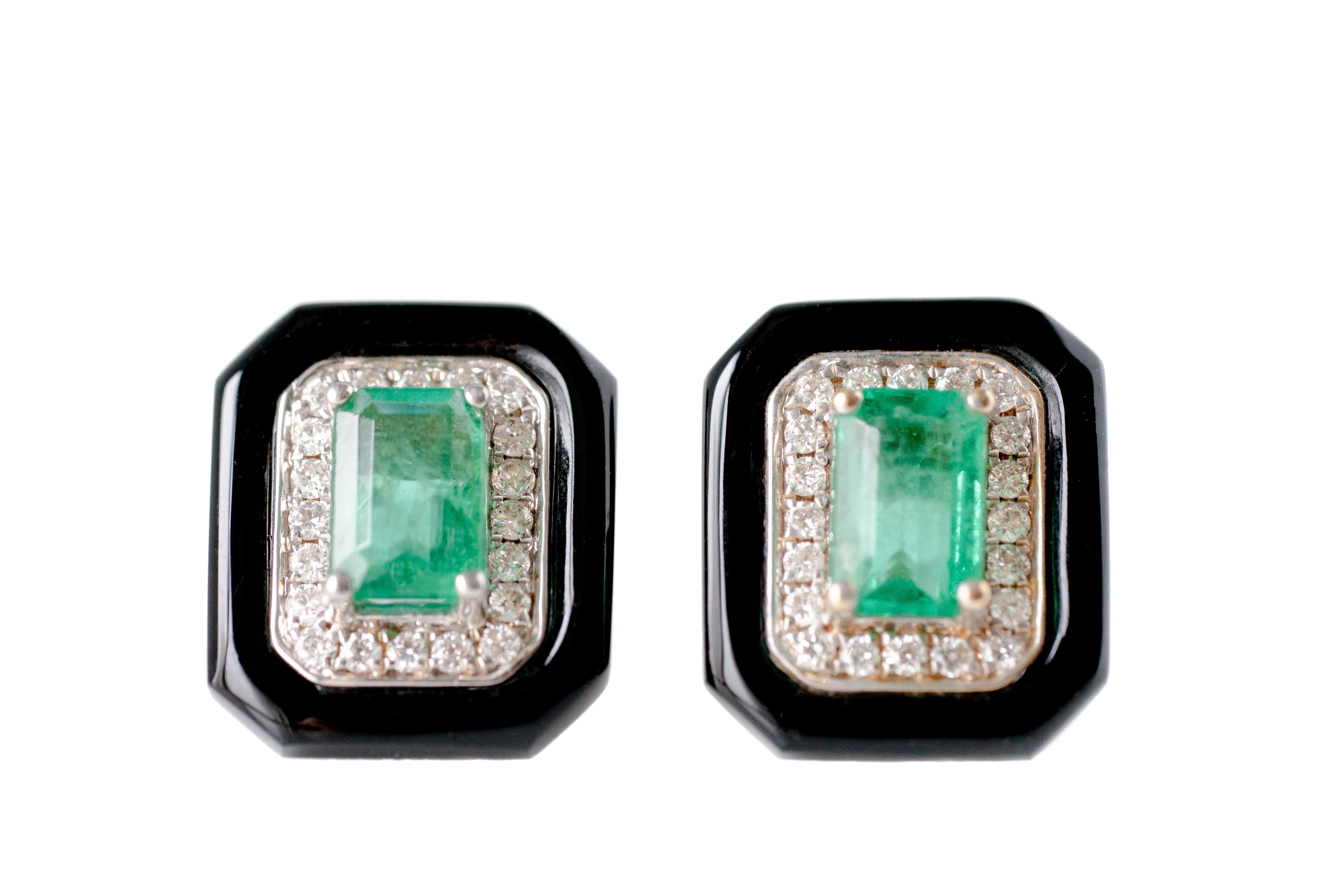 Art Deco-Inspired Emerald Earring Studs - 14 karat White Gold, Yellow Gold, Diamonds, Emerald, Onyx

Features:
Art Deco-Inspired Design
1.5 carat total Emeralds
0.40 carat total Diamonds
Round Brilliant Diamond Halo
Onyx Outer Frame
Prong Set