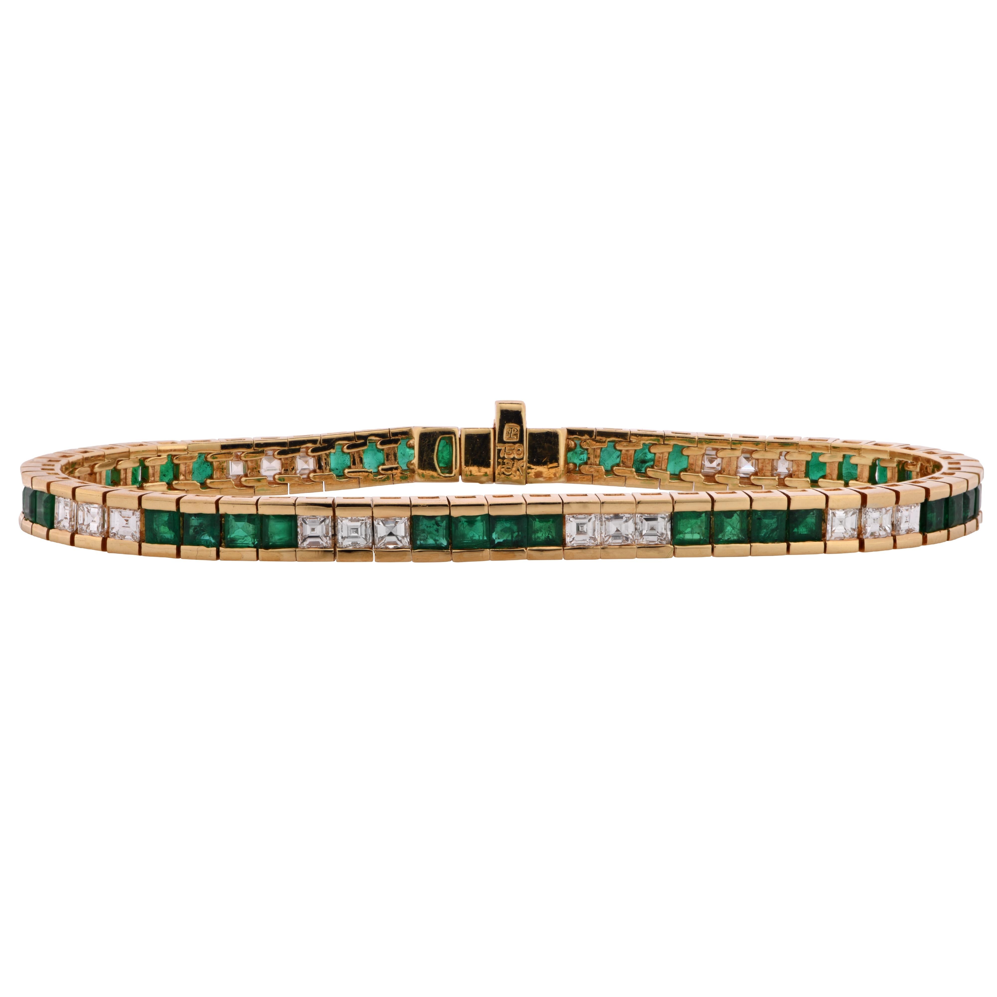 Gorgeous bracelet crafted in 18K yellow gold featuring 27 carre cut diamonds weighing approximately 3.25 carats total G color and VS clarity and 27 square emeralds weighing approximately 8 carats total. This fabulous bracelet measures 7.75 inches in