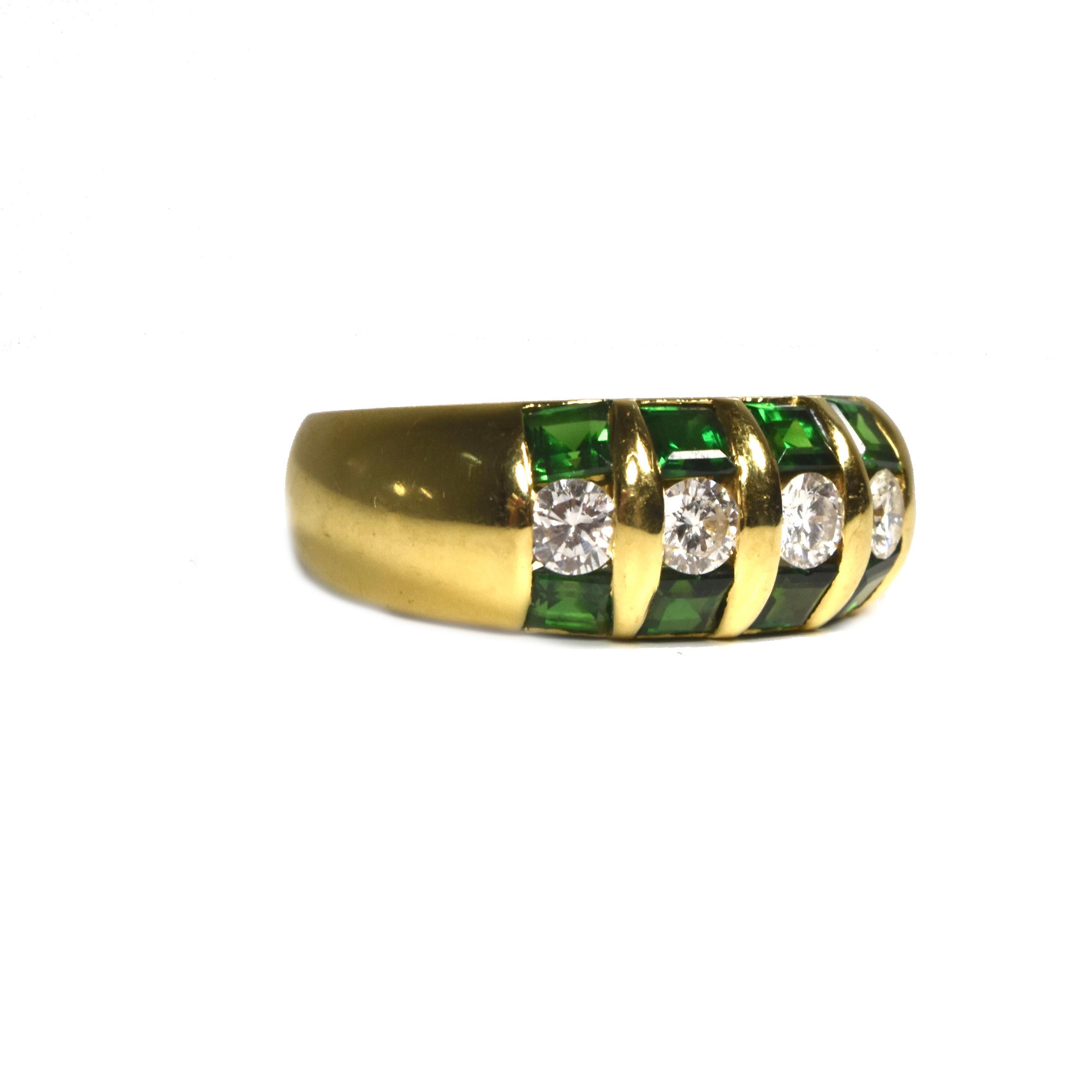 This very beautiful band ring features approx. 1 tcw (total carat weight) of dazzling diamonds surrounded by 8 square cut gleaming emeralds. The emeralds’ hue is a very deep saturated green, not too dark nor too light, they enhance the fire of each