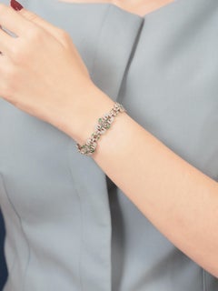 Bracelet en or blanc 18 carats avec diamants et émeraudes de style Art déco