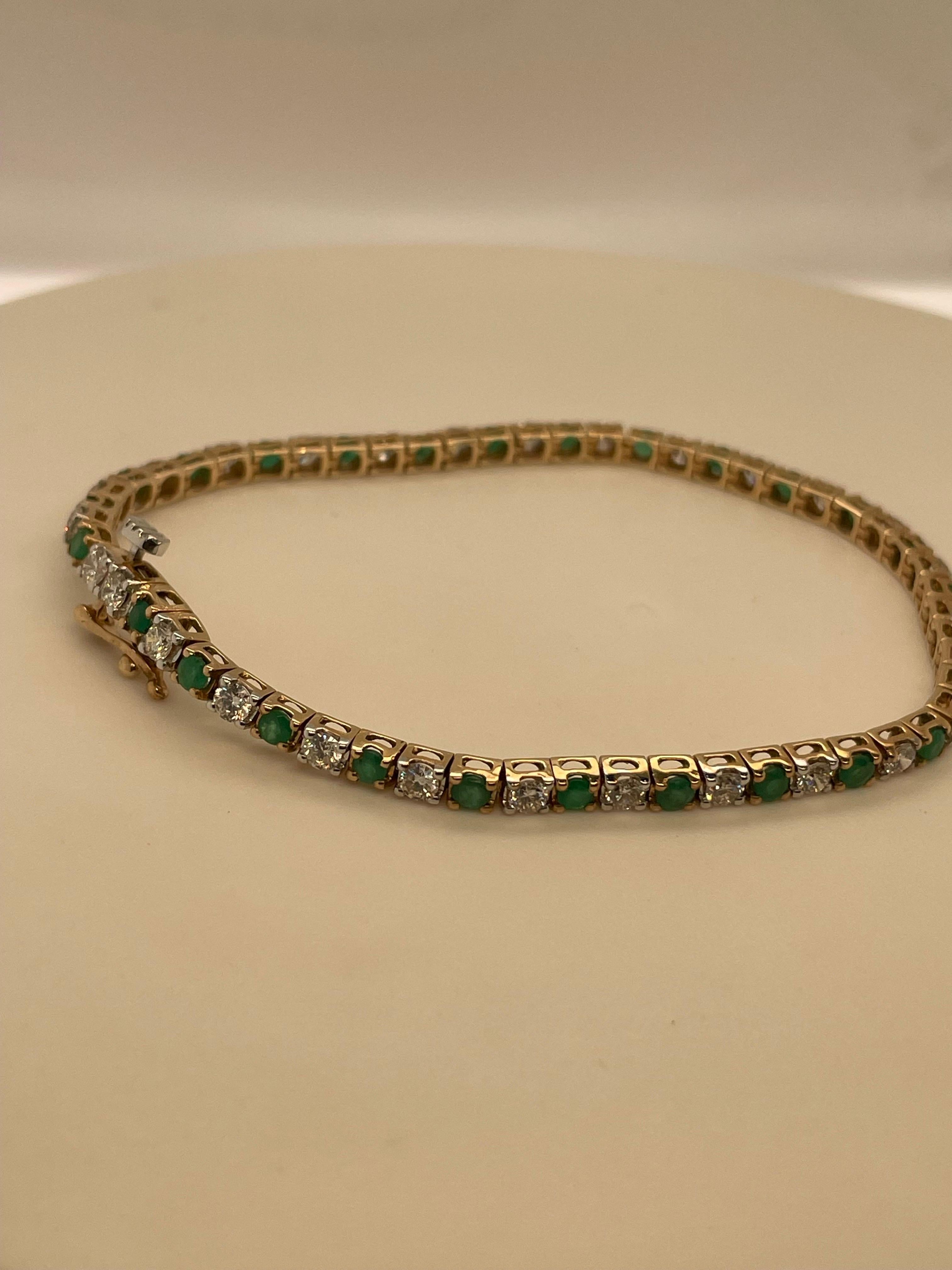 This is a stunning bracelet featuring a classic tennis bracelet design. It's crafted in 9-carat yellow gold and showcases a beautiful contrast between the sparkling diamonds and the vibrant green emeralds.

Specific Details:

Metal: 9-carat yellow
